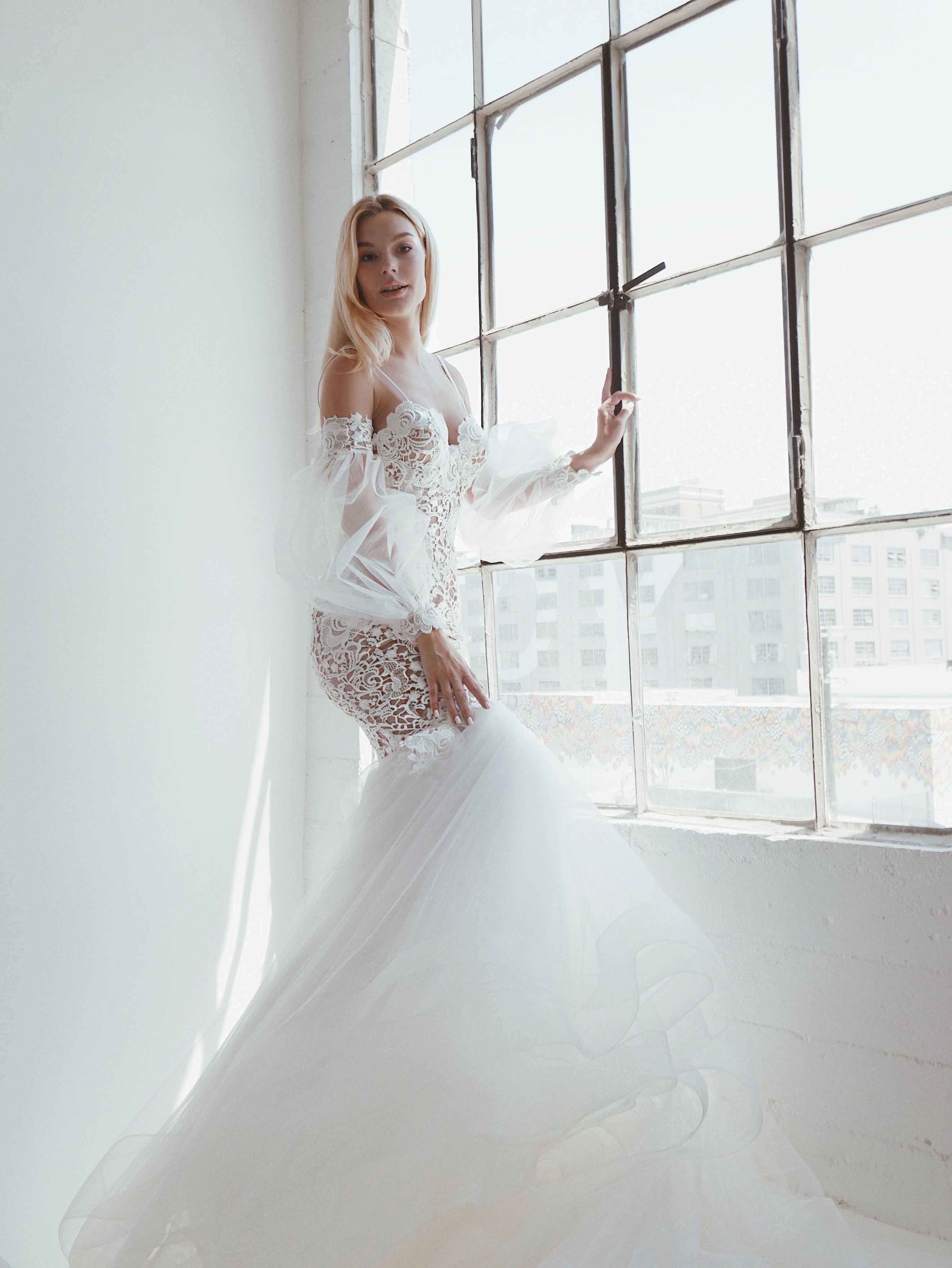 Arcadia by Lauren Elaine Bridal guipure lace mermaid wedding dress with removable bishop sleeves