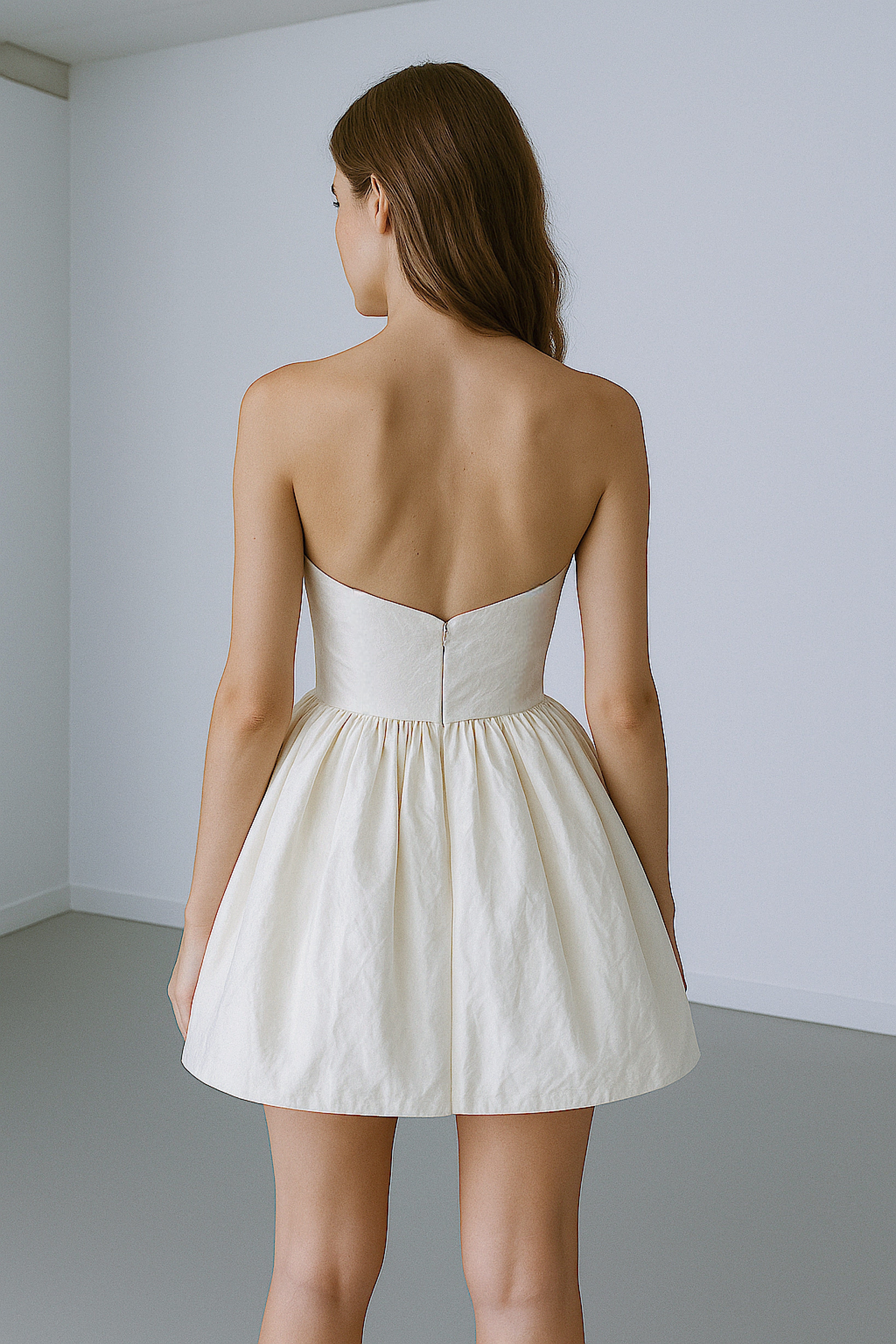 Back view of Amorette mini wedding dress with silk taffeta skirt and invisible zipper closure.