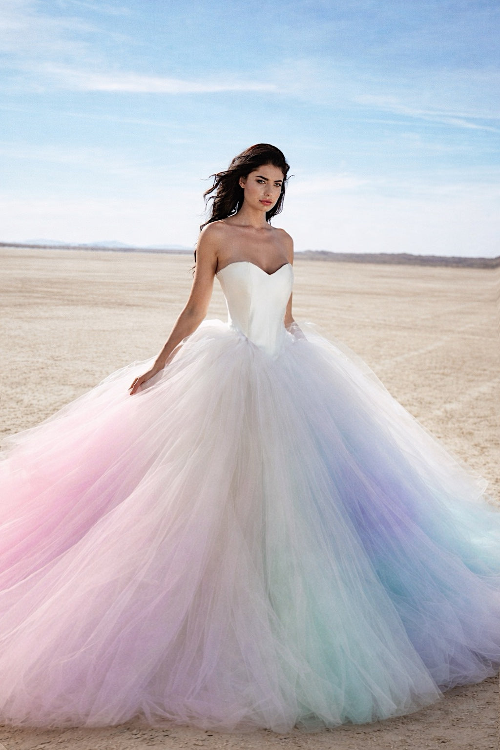 Ombré pastel rainbow wedding dress with feathered tulle skirt and structured bodice, bridal gown.