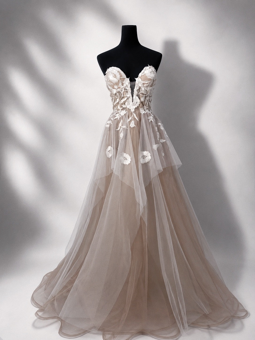 Arrowyn ethereal wedding dress displayed on mannequin with illusion corset.