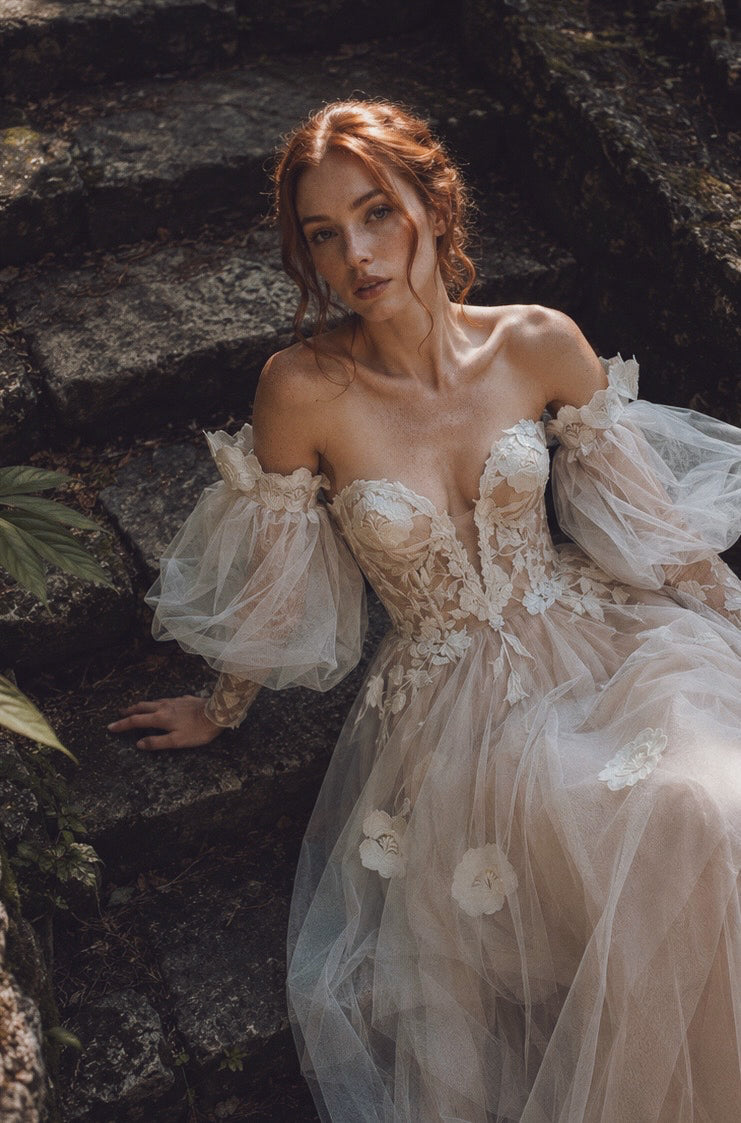 Arrowyn ethereal wedding dress with illusion corset and layered tulle skirt in woodland ruins.