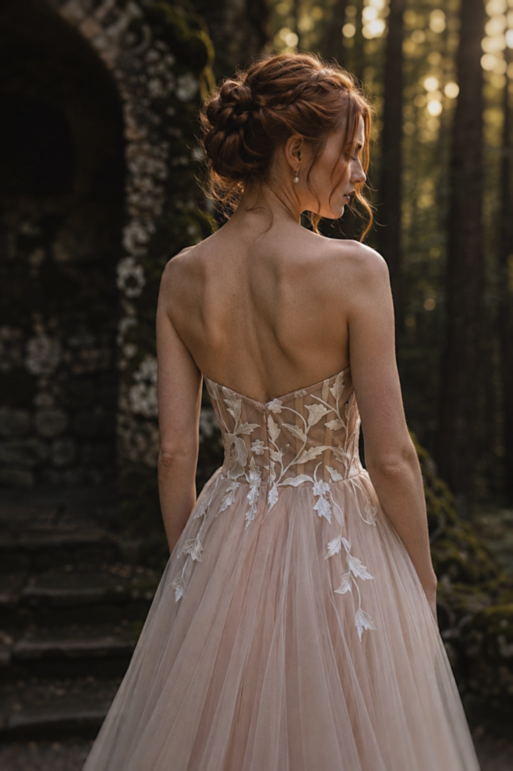 Close-up back view of Arrowyn illusion corset with botanical floral appliqué.