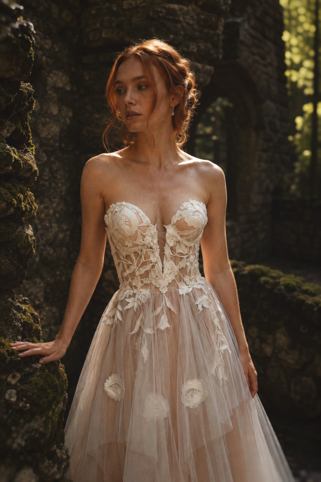 Arrowyn strapless ethereal wedding dress with illusion corset and botanical floral appliqué.