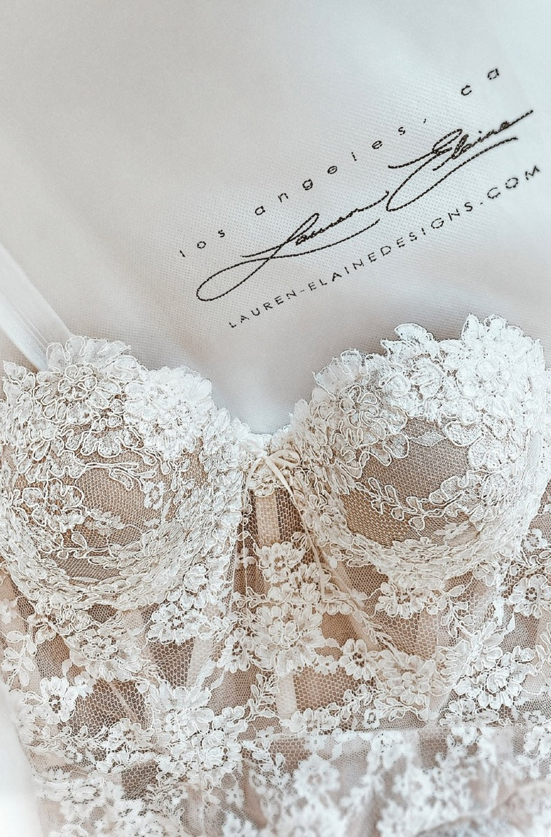 A couture wedding dress lace corset inside the Lauren Elaine bridal showroom