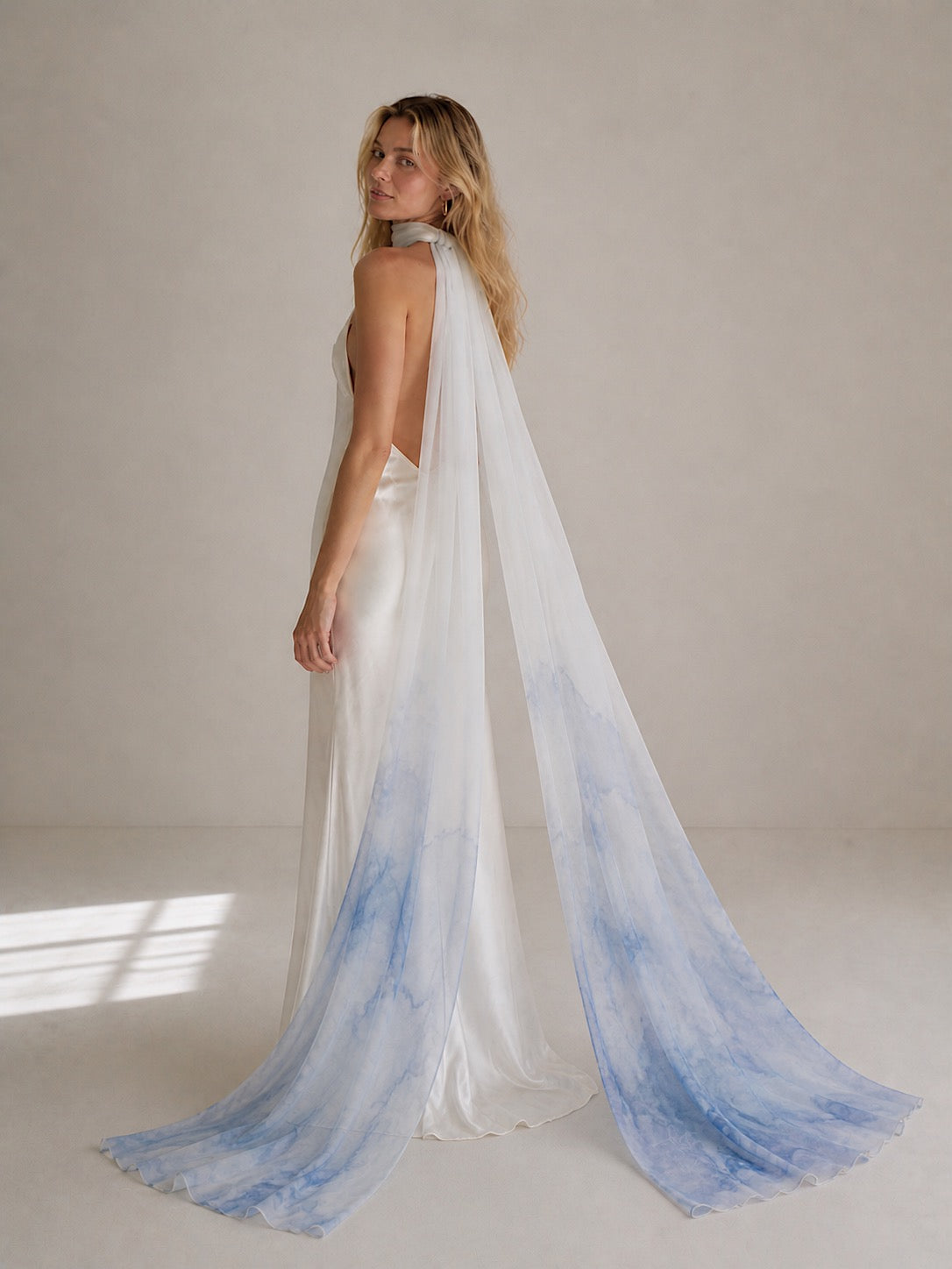 Powder blue watercolor bridal neck scarf in flowing chiffon styled with ivory satin bridal gown