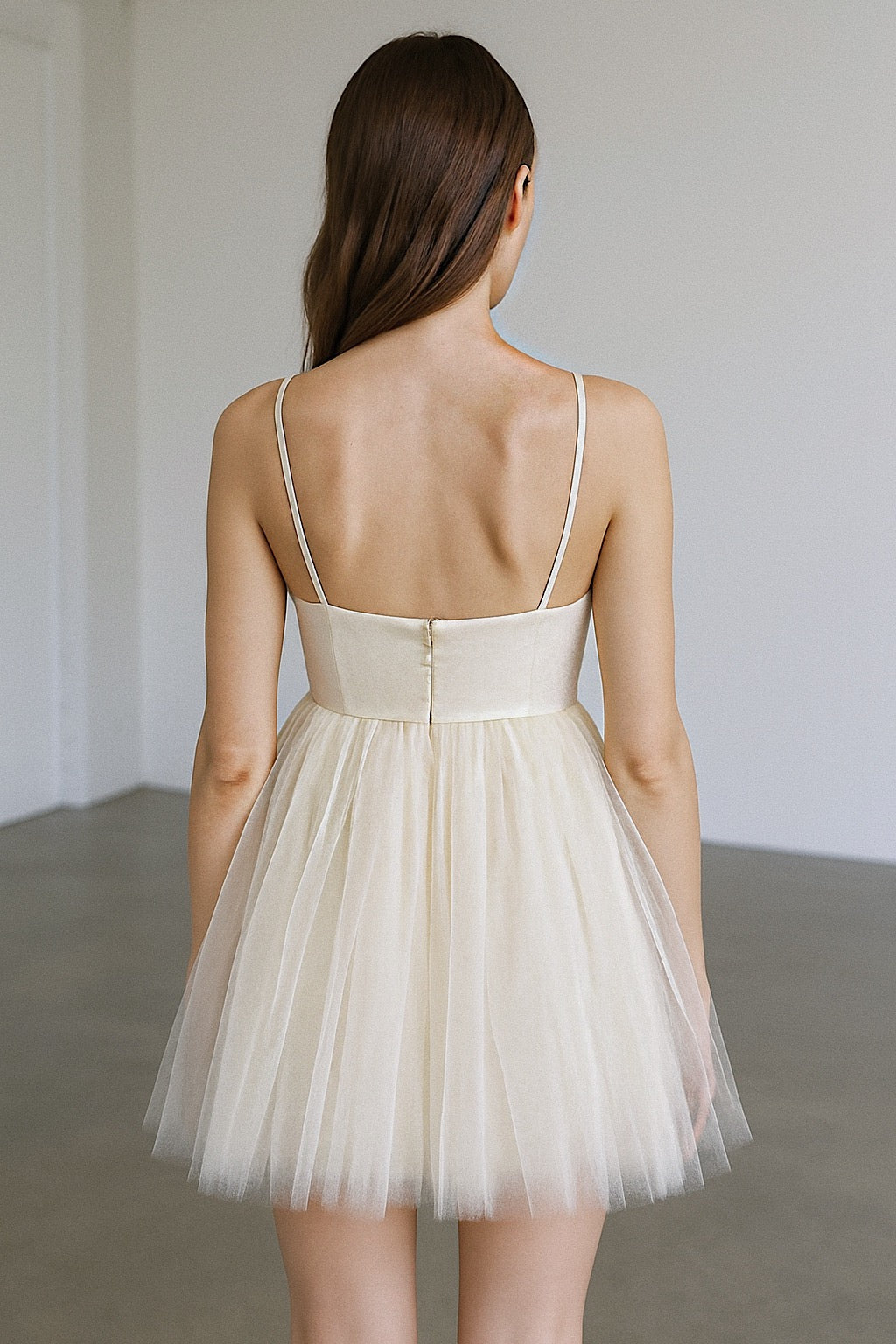 Back of Dolly bridal mini gown with empire waist and babydoll tulle skirt