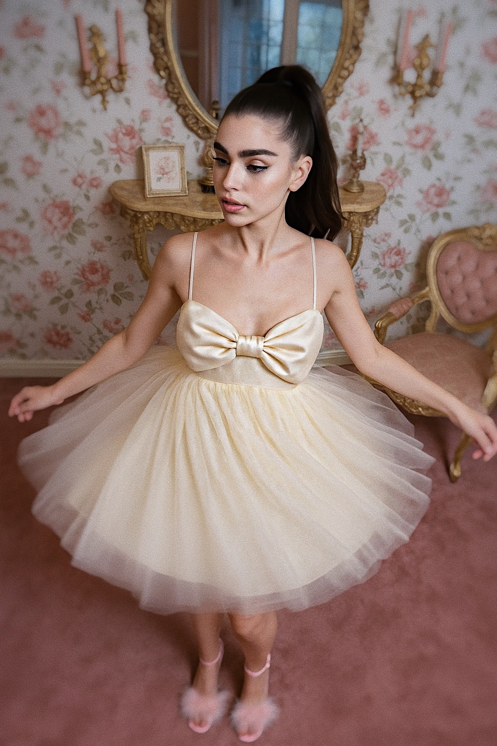 Bride twirling in Dolly empire waist mini wedding dress with oversized bow and fluffy tulle skirt