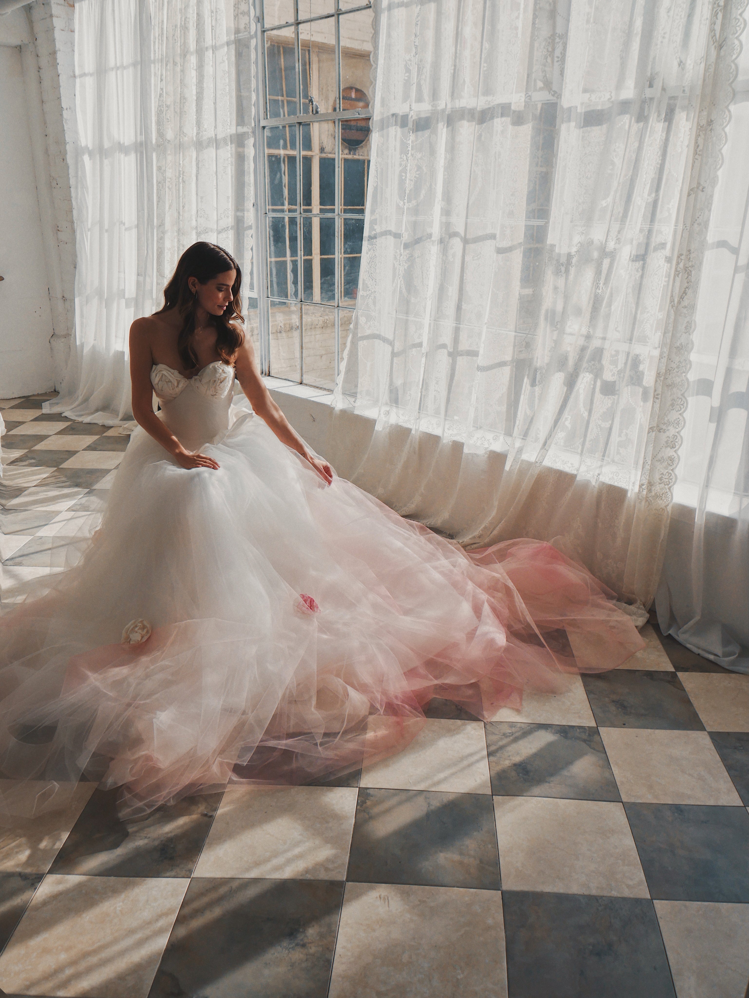 Alice in Wonderland themed wedding dress with corset bustier on checkered floor