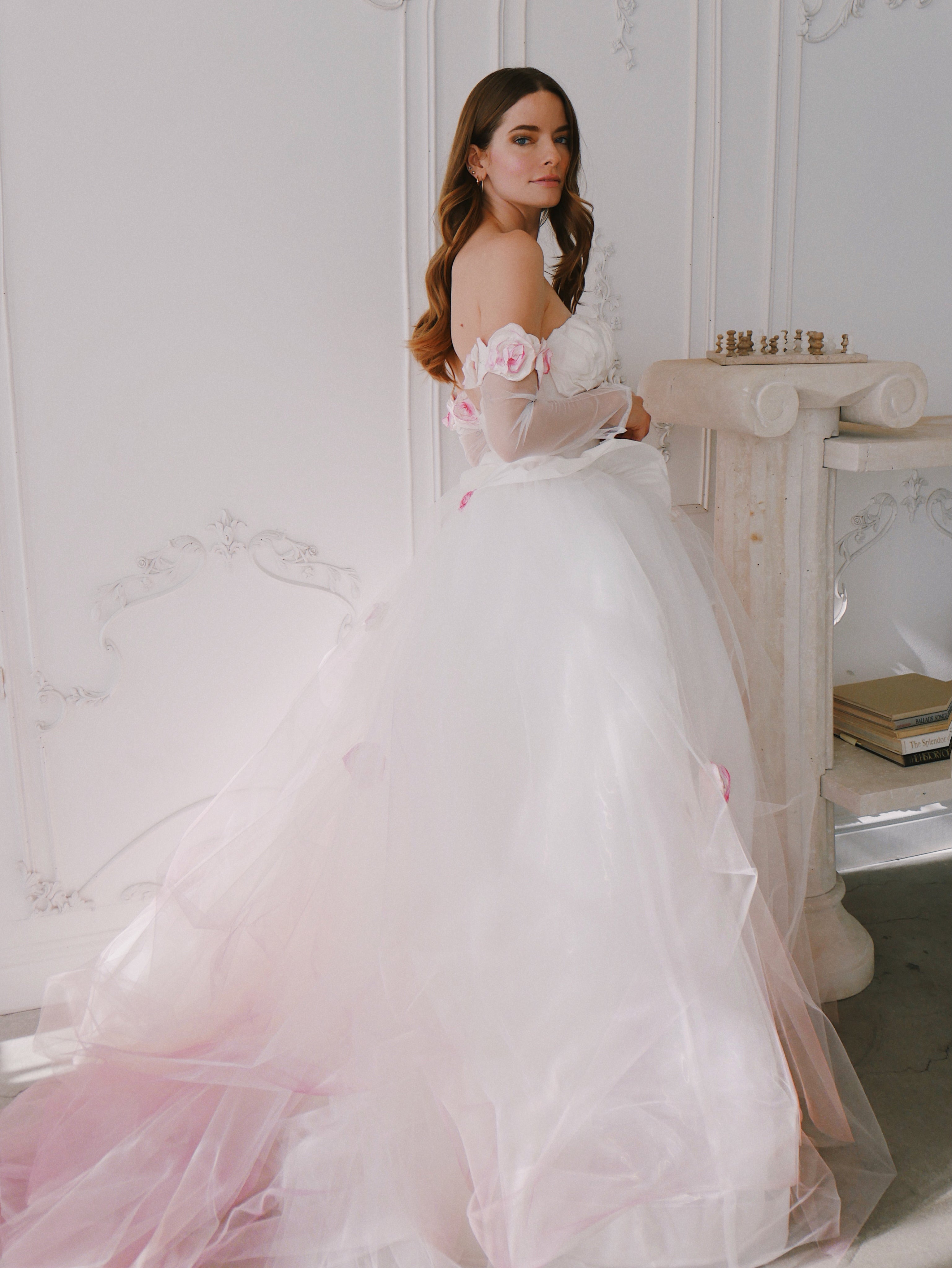 Side shot of bridal gown with blush ombre on blond model