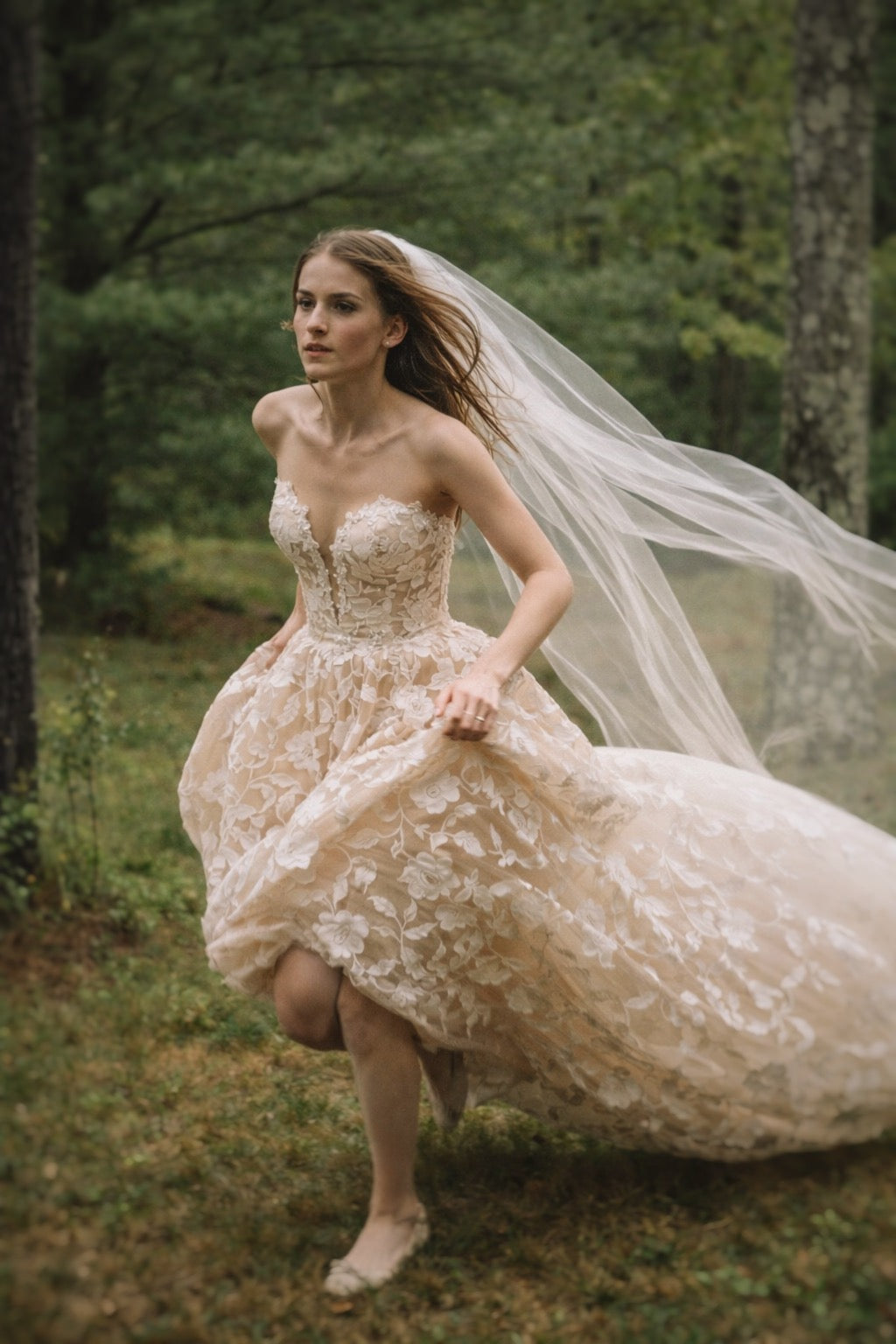 Elowen luxury floral lace wedding dress with nude underlay and illusion bodice in woodland setting