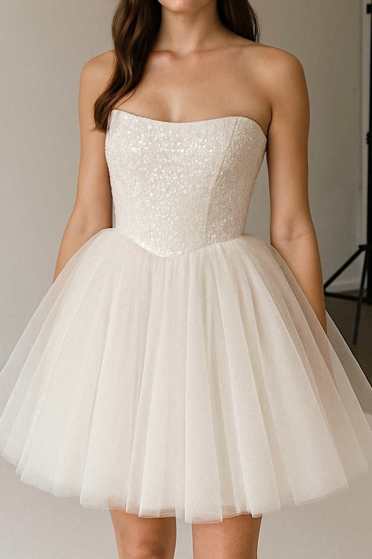 Studio shot of Étoile mini wedding dress with sequin strapless bodice and tulle skirt