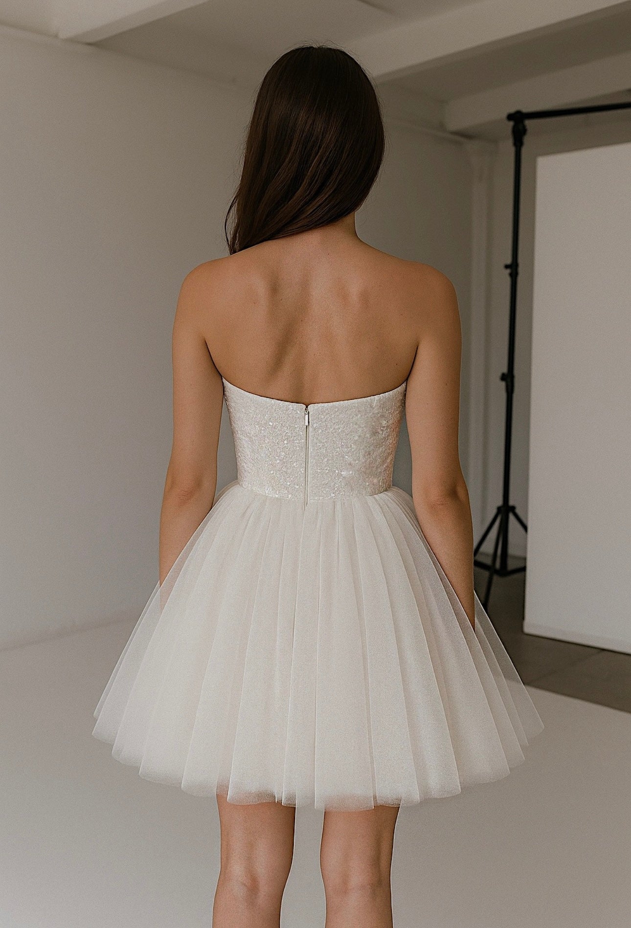 Back view of Étoile bridal mini with strapless sequin bodice, tulle skirt, and invisible zipper closure