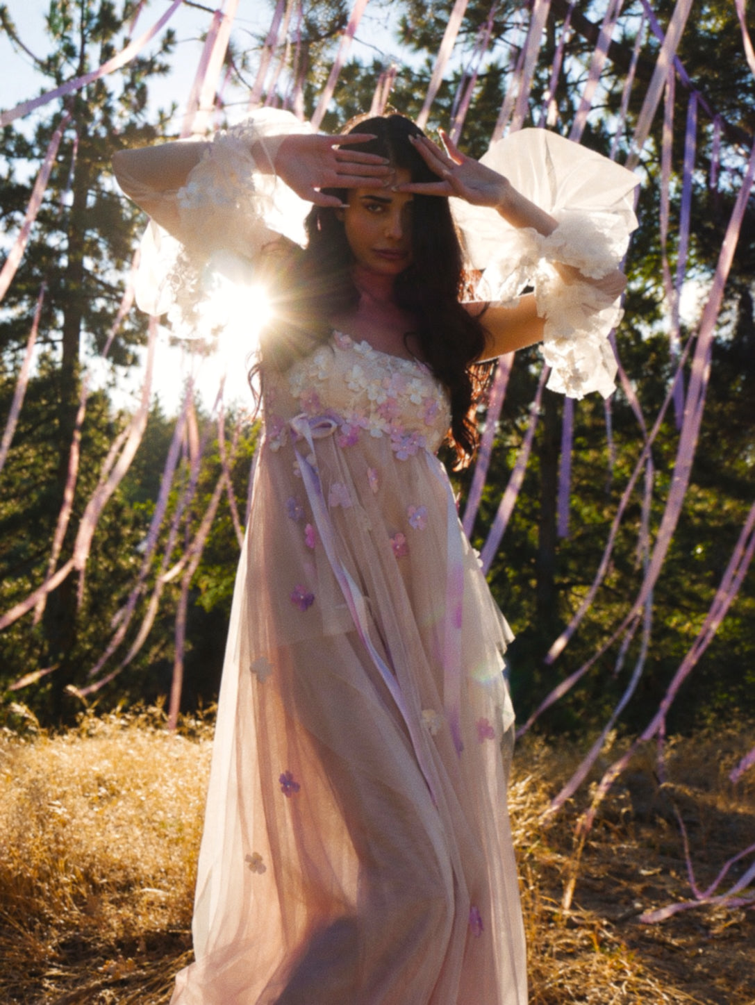 Florêve floral appliqué wedding dress with pink and lavender wildflowers, sheer statement sleeves and ribbon details