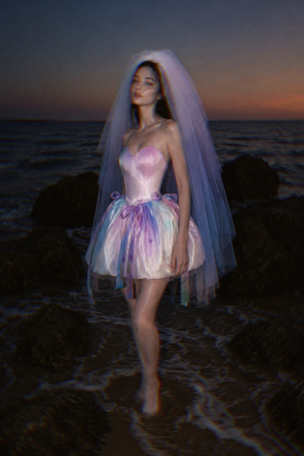 Moondreamer Mini colorful bridal mini dress paired with a pastel ombre wedding veil in shades of pink, lavender, and blue