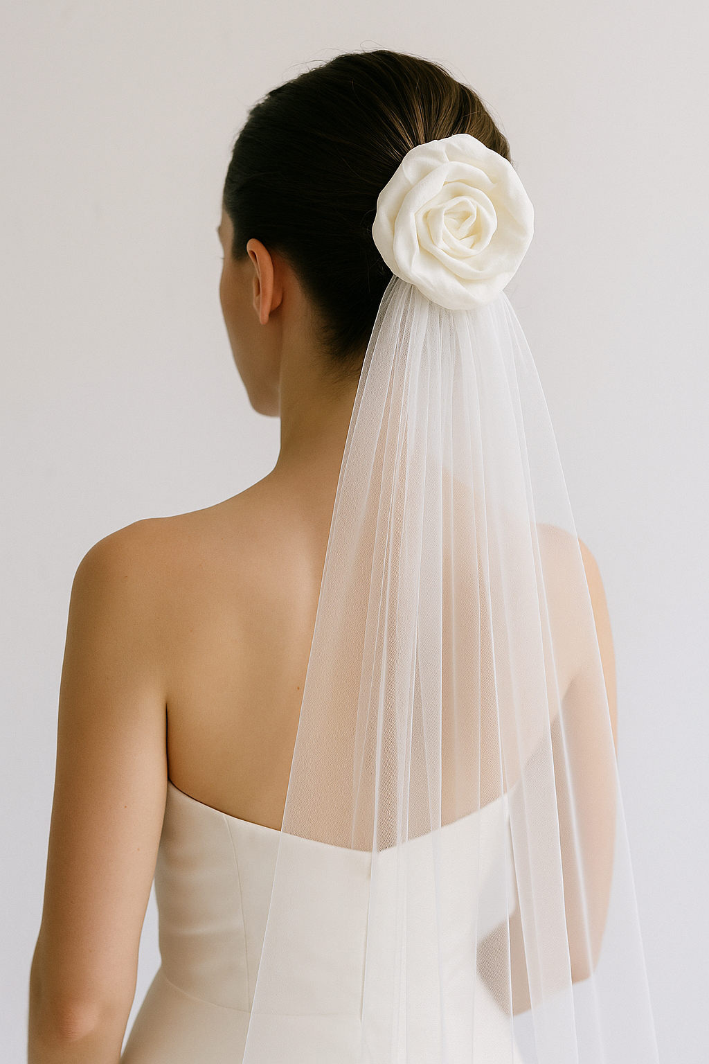 Close-up of handcrafted ivory silk taffeta rose bridal veil