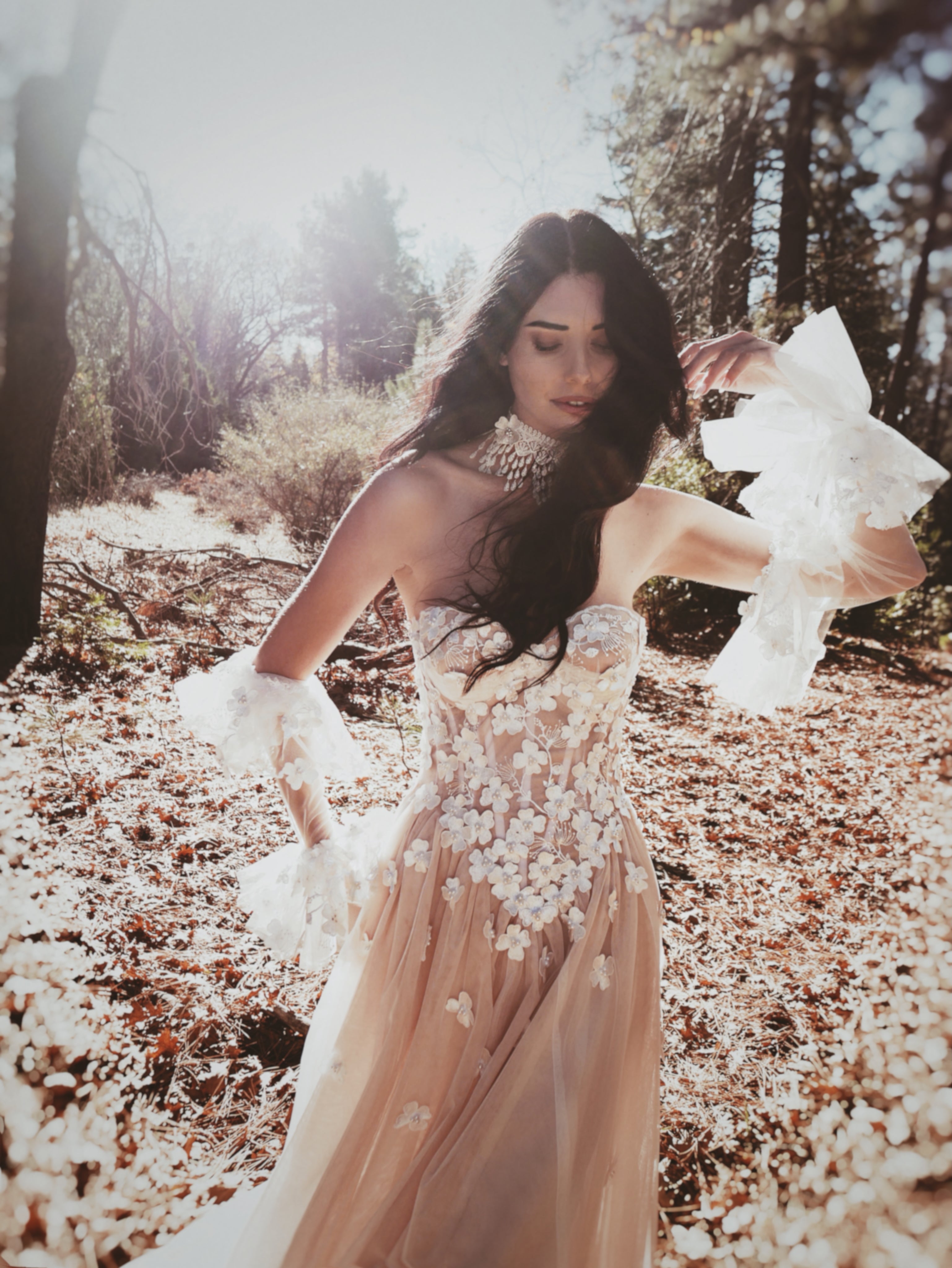 Valen bohemian bridal gown featuring detachable floral tulle sleeves, sheer corset bodice, and soft romantic A-line silhouette