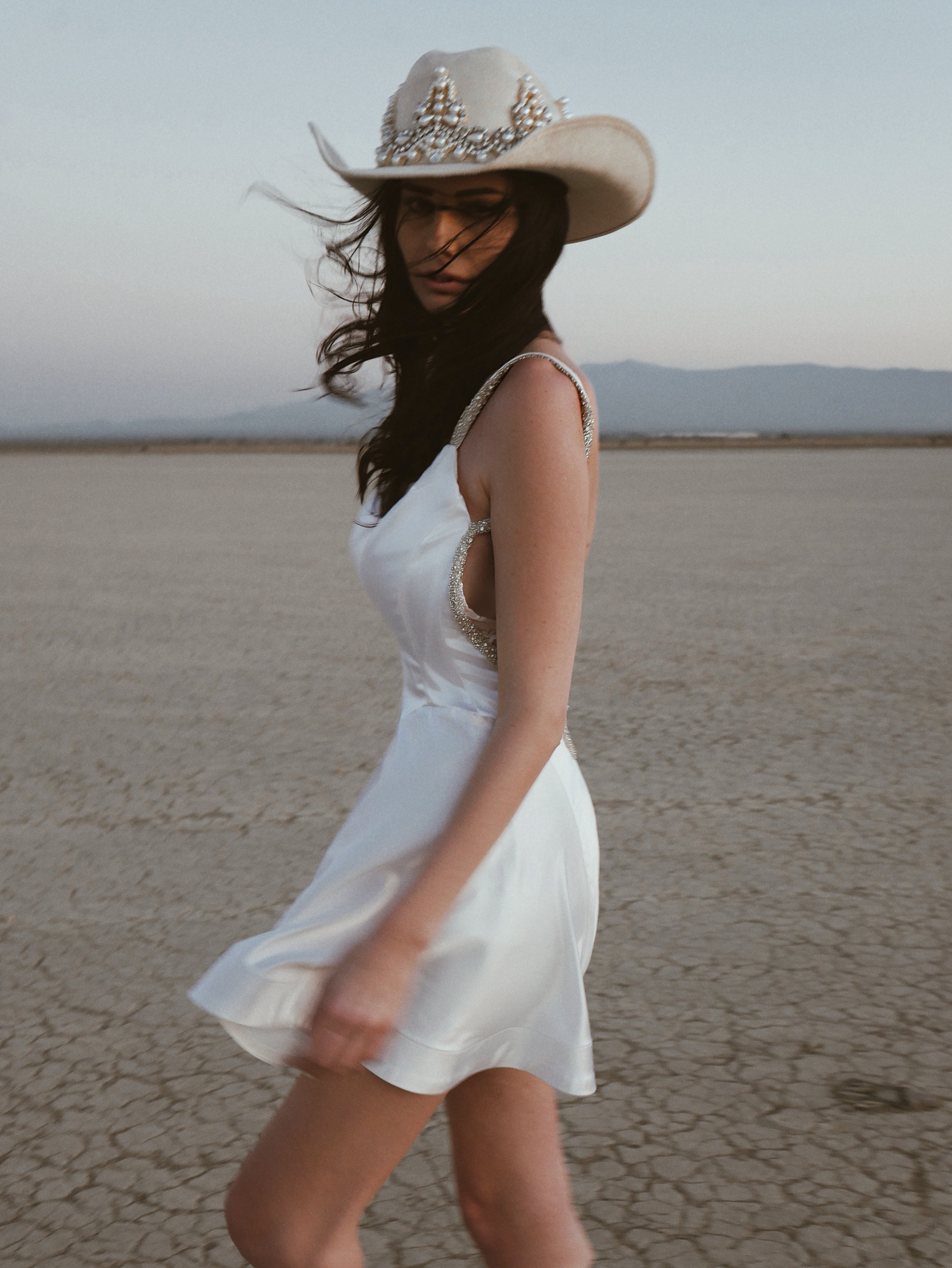 Western-inspired Lauren Elaine Affinity Backless Satin Mini Wedding Dress with crystals