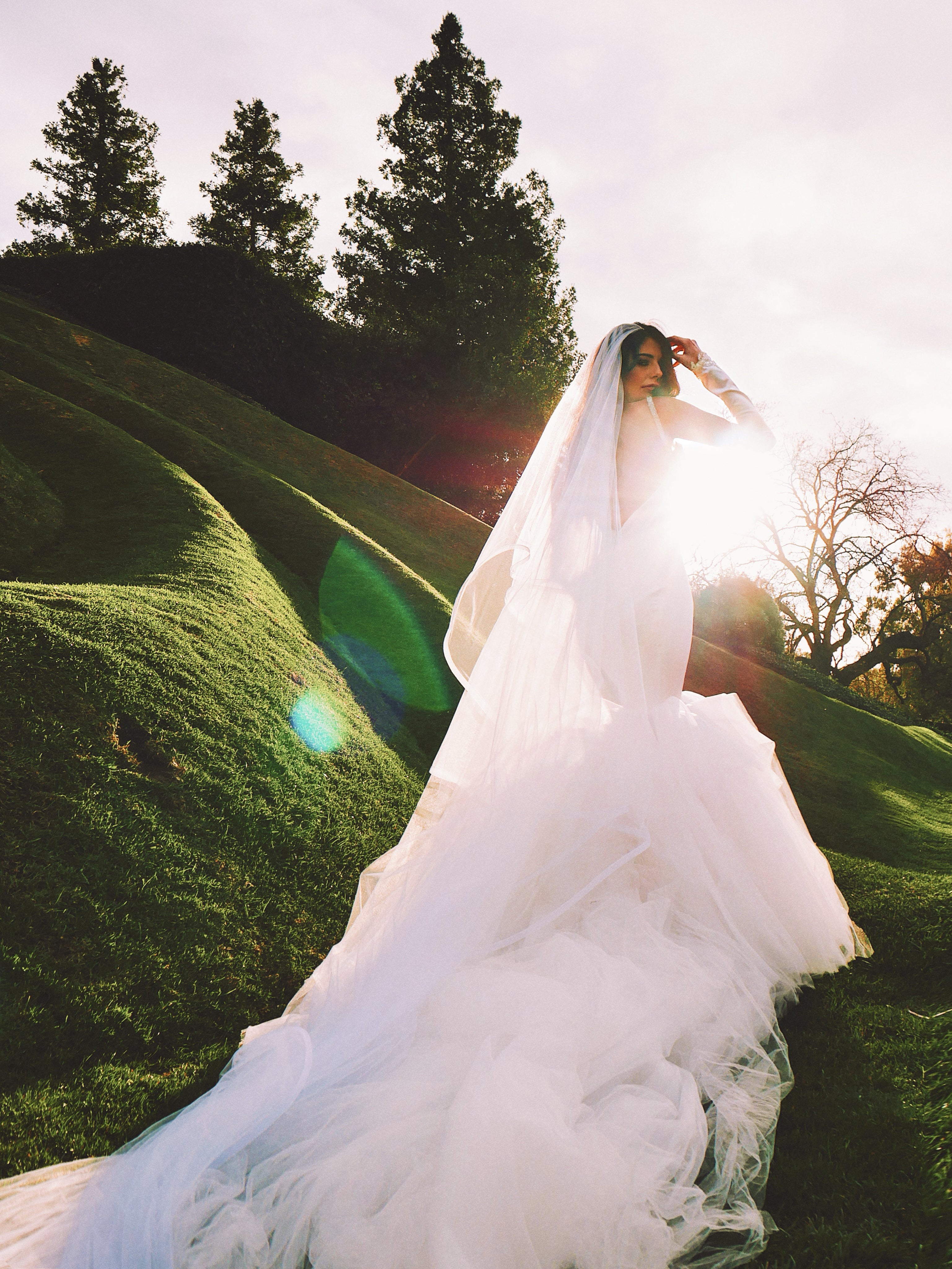 Satin mermaid wedding dress with cathedral train by Lauren Elaine Los Angeles