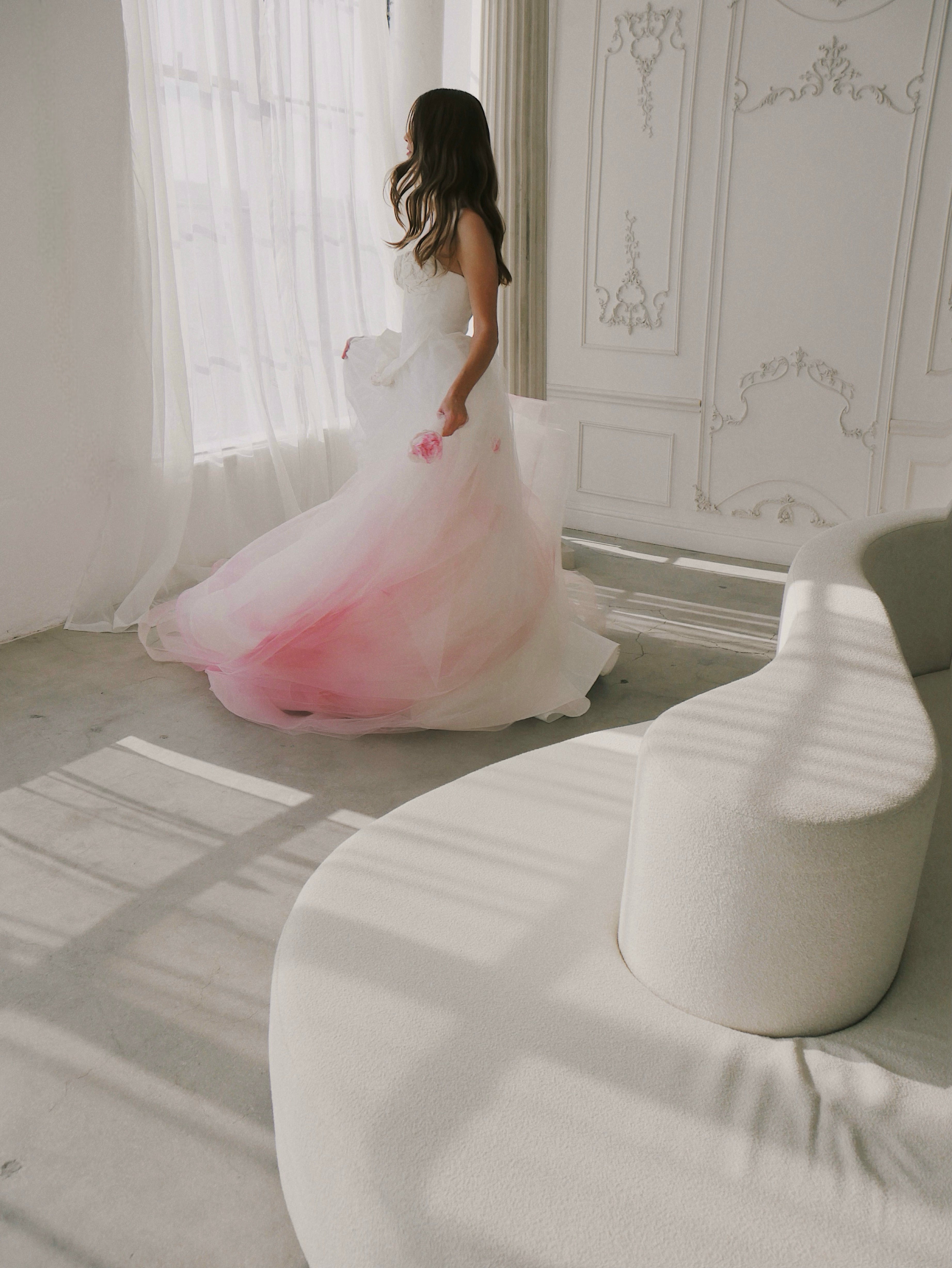 Wide shot of blush ombre Disney princess wedding gown