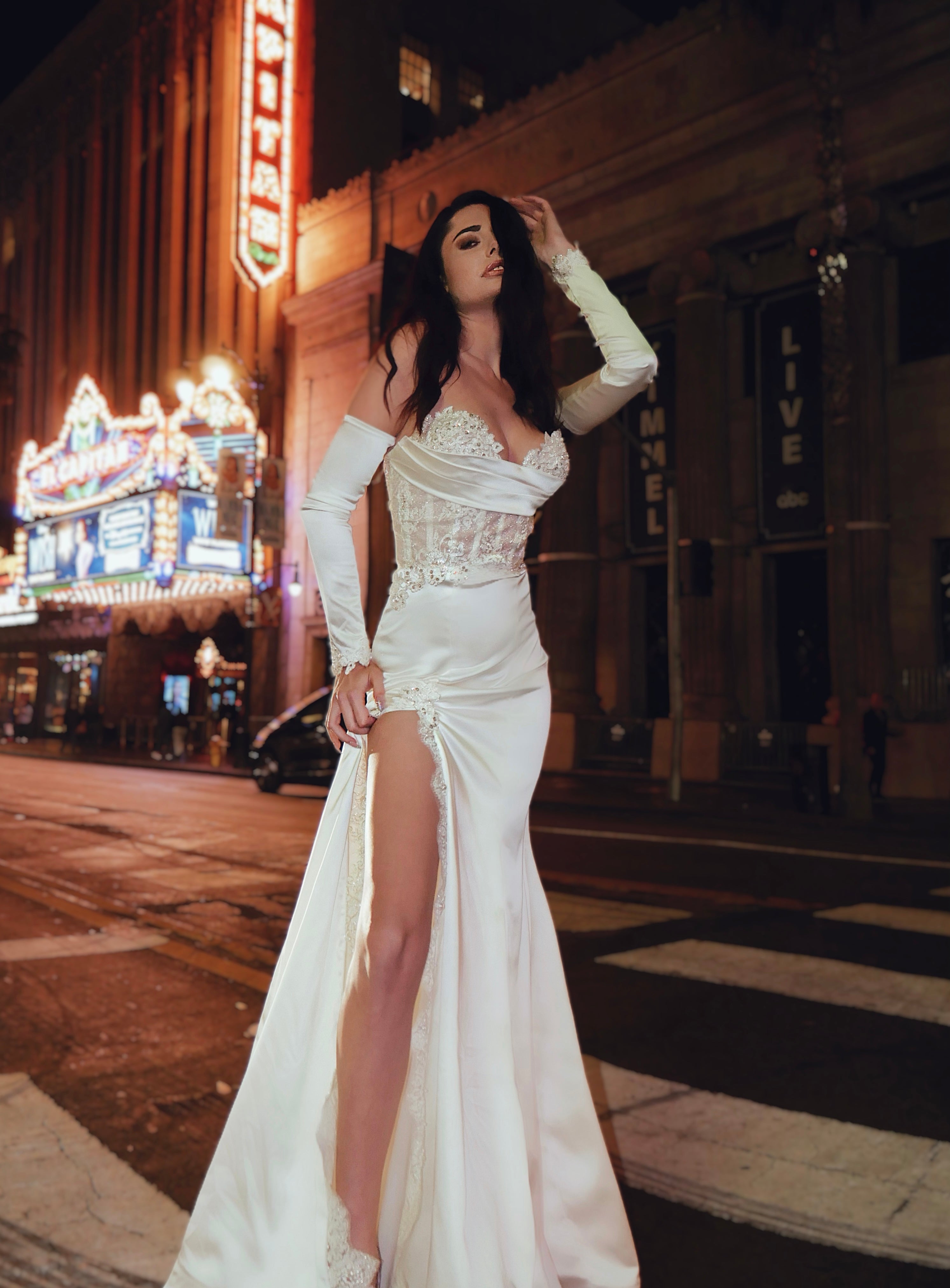 Front view of satin glove bridal sleeves worn by a model on Hollywood blvd.