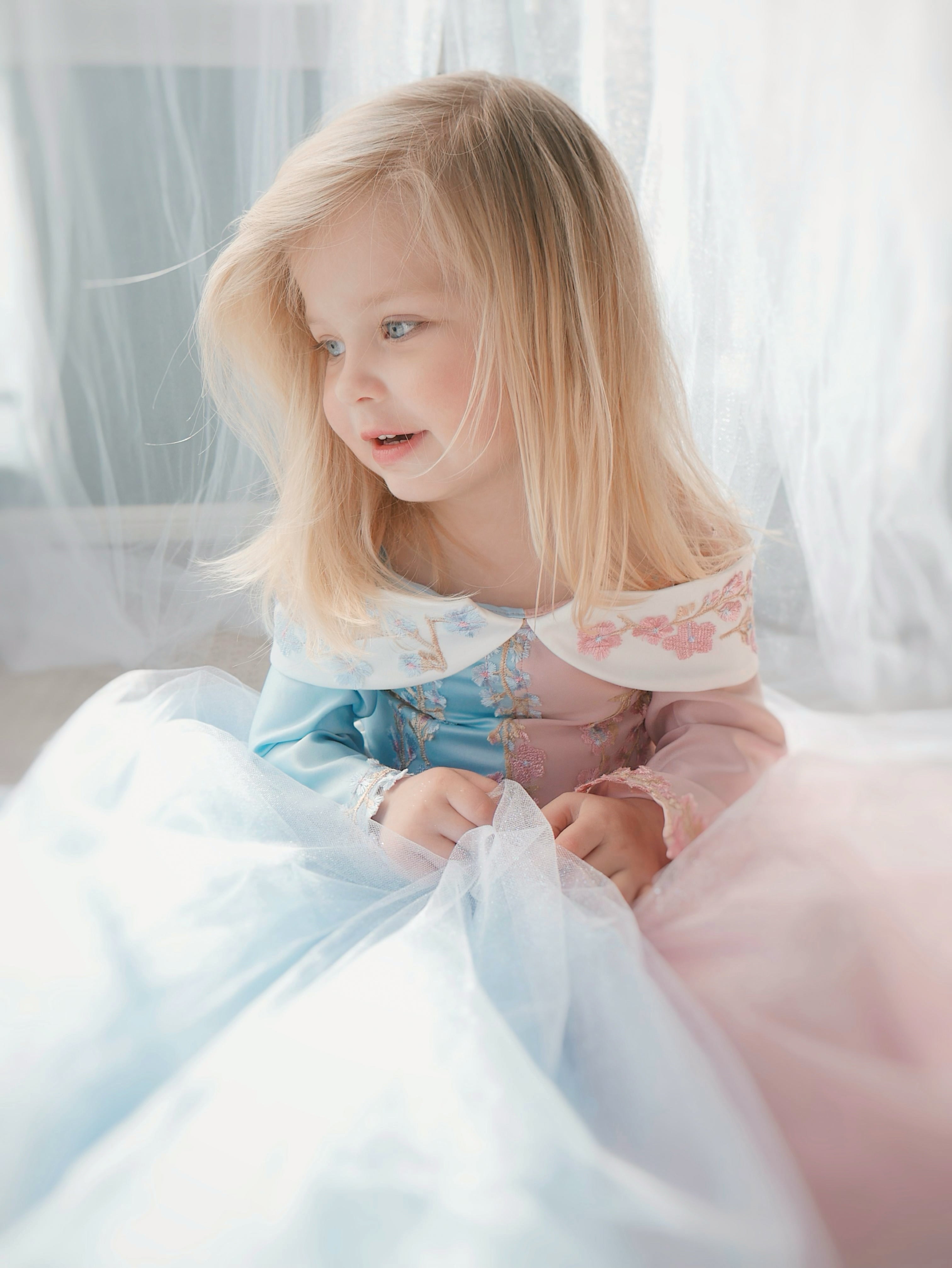 Faire Everlaine wears a Sleeping Beauty Princess Aurora Dress for girls by Lauren Elaine