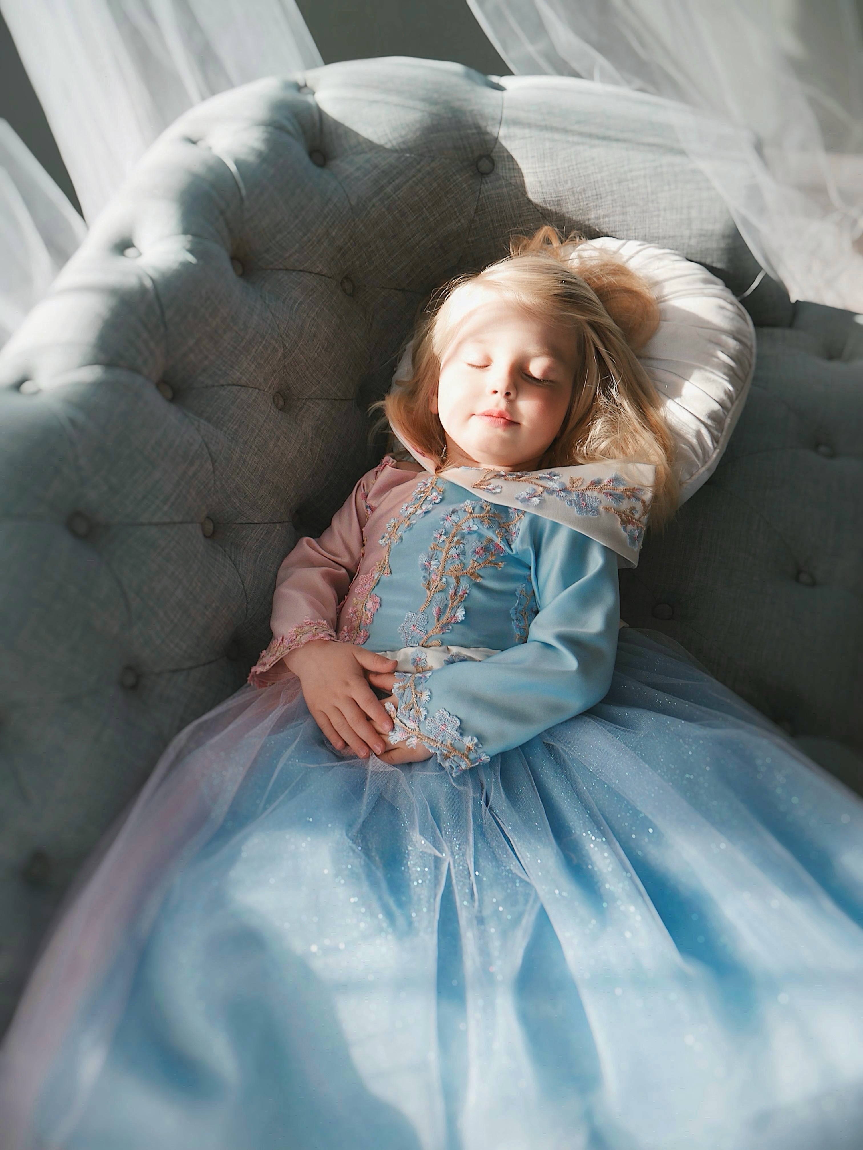 Faire Everlaine wears a Sleeping Beauty Princess Aurora Dress for girls by Lauren Elaine