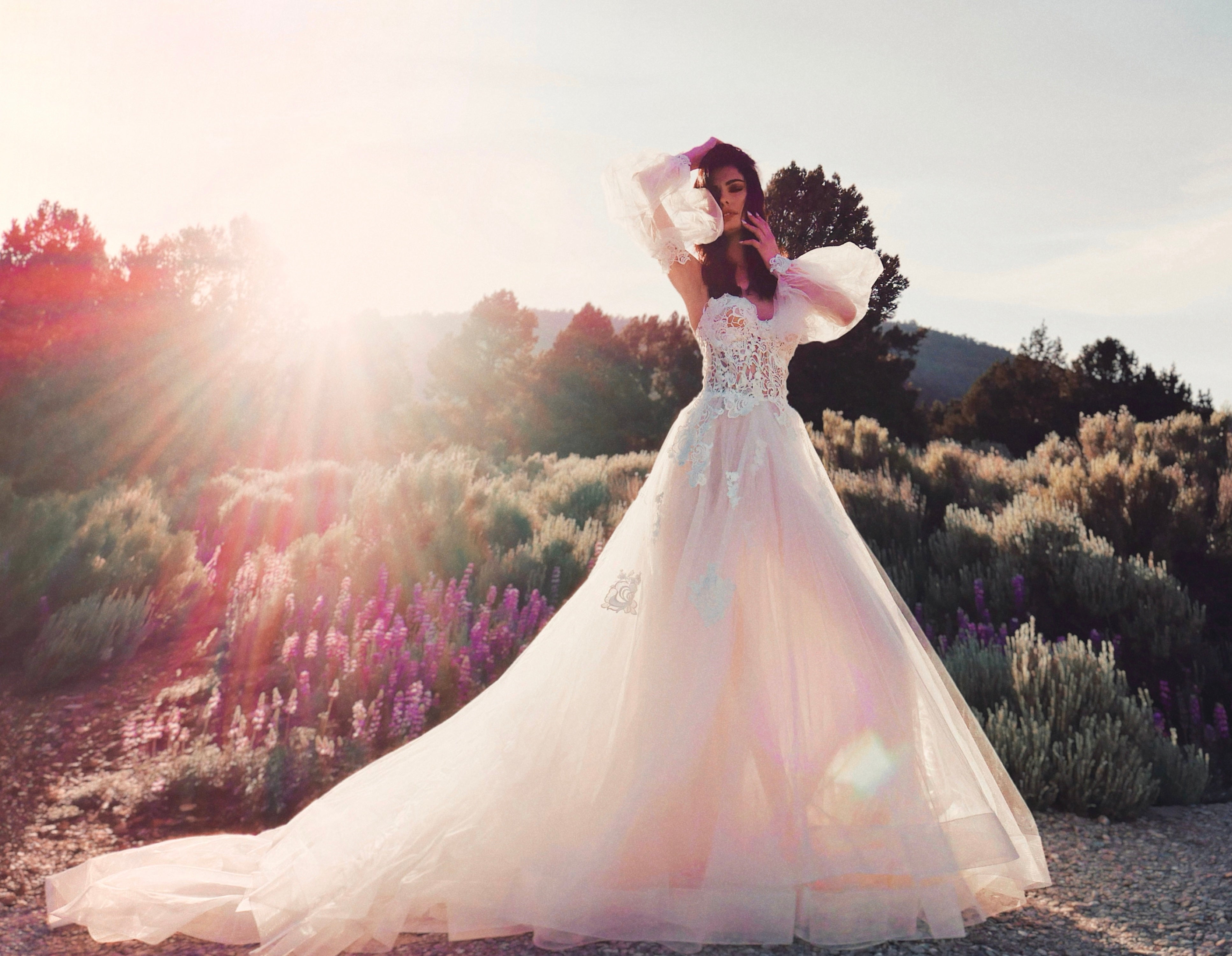 Guipure lace corset wedding gown with detachable off the shoulder bishop sleeves.