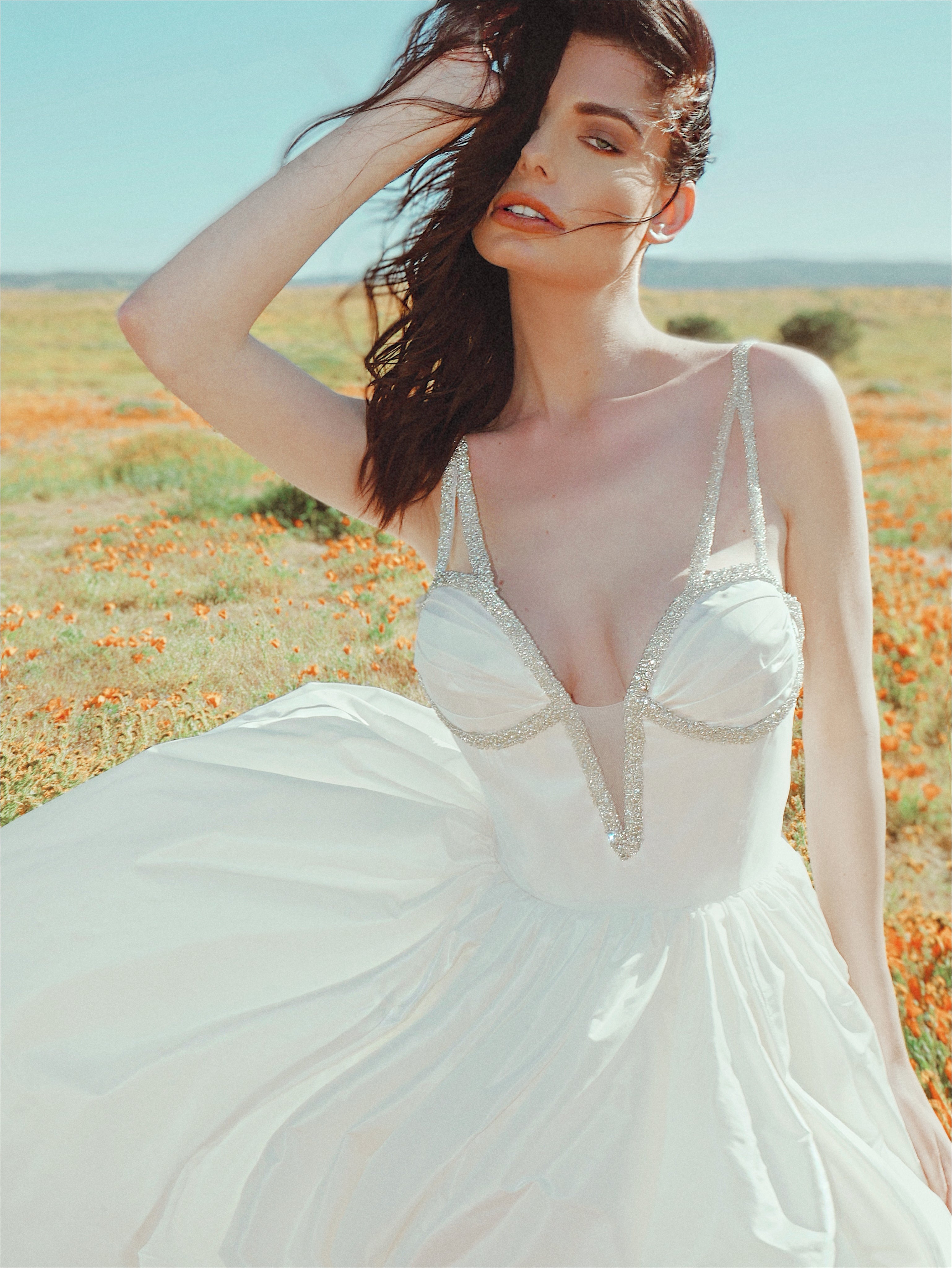 A closeup image of the crystal detailing on the Lauren Elaine Vespertine Gown