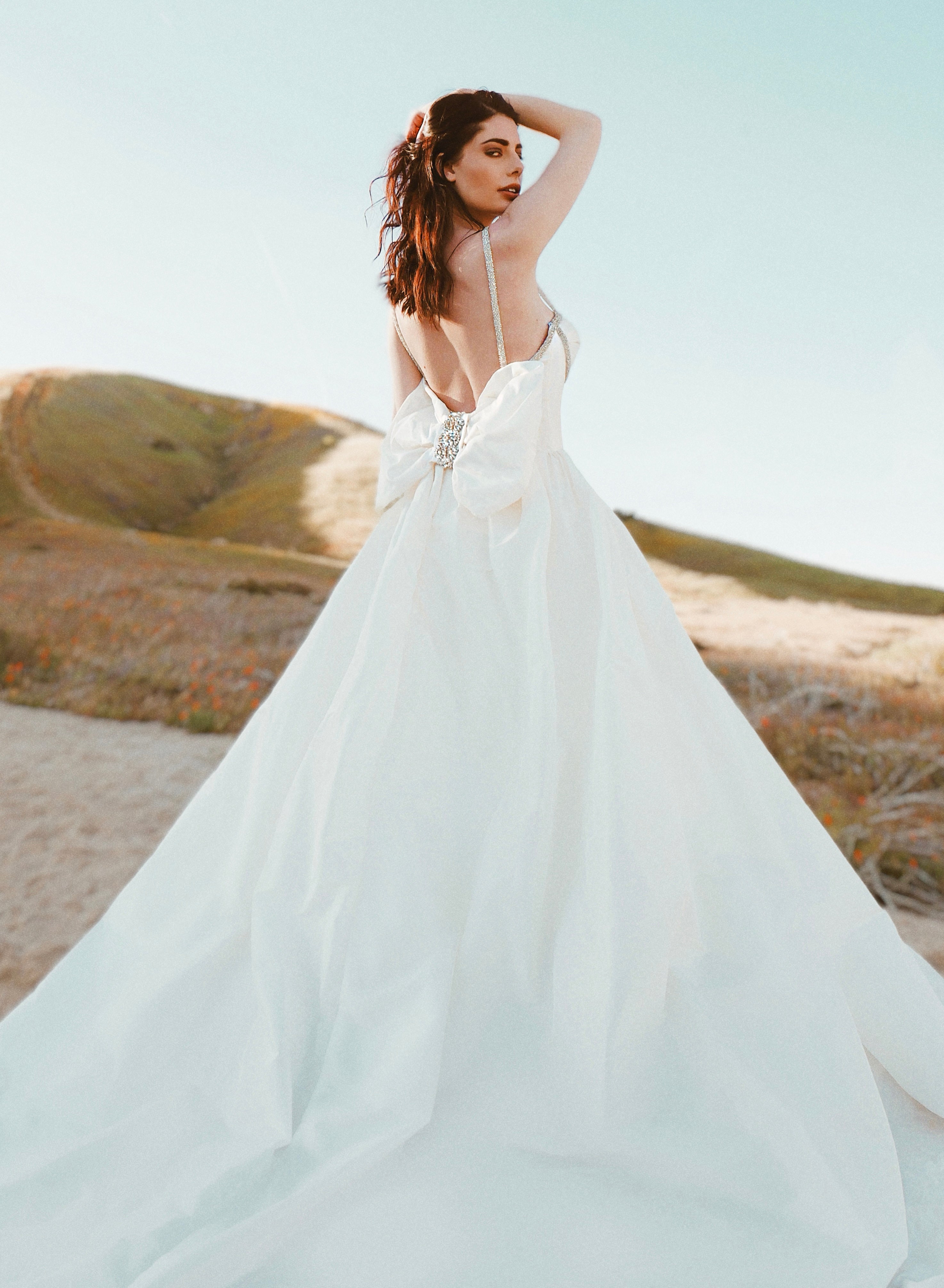 Wedding gowns with detachable bows by Lauren Elaine Bridal Los Angeles