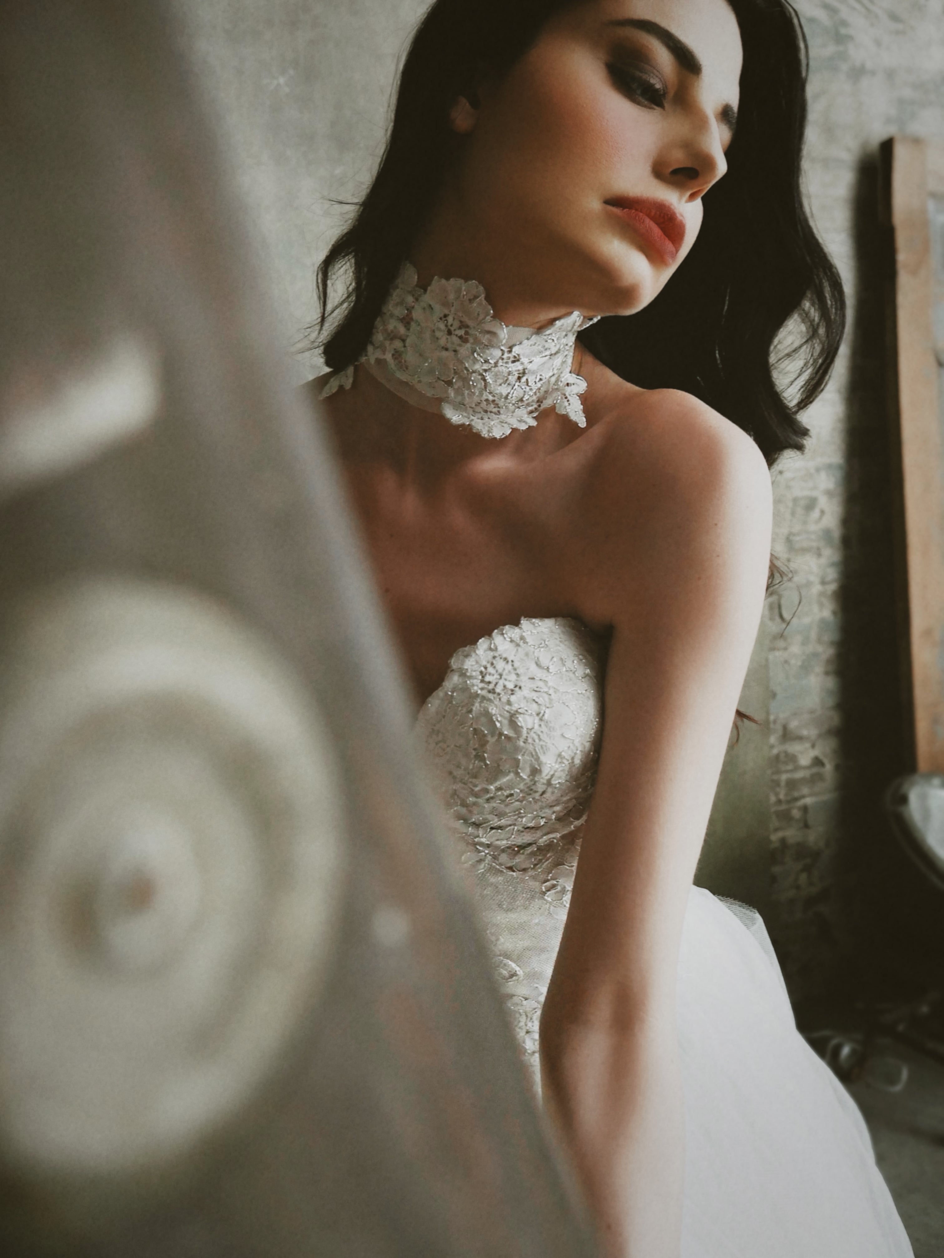A model poses in the Chantilly Lace Bridal Choker by Lauren Elai