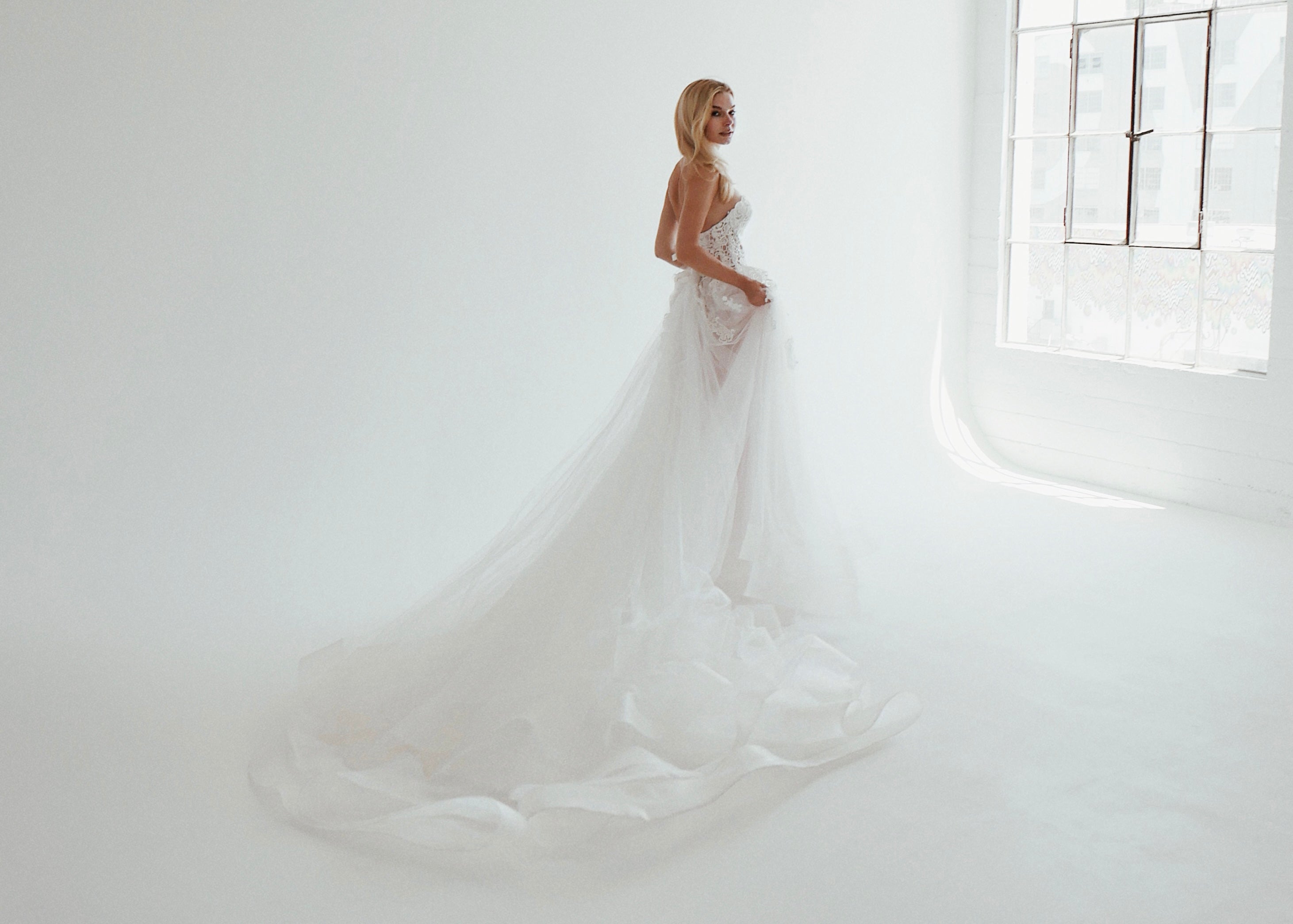 A model wears the Lauren Elaine Pastora gown in a studio in downtown Los Angeles