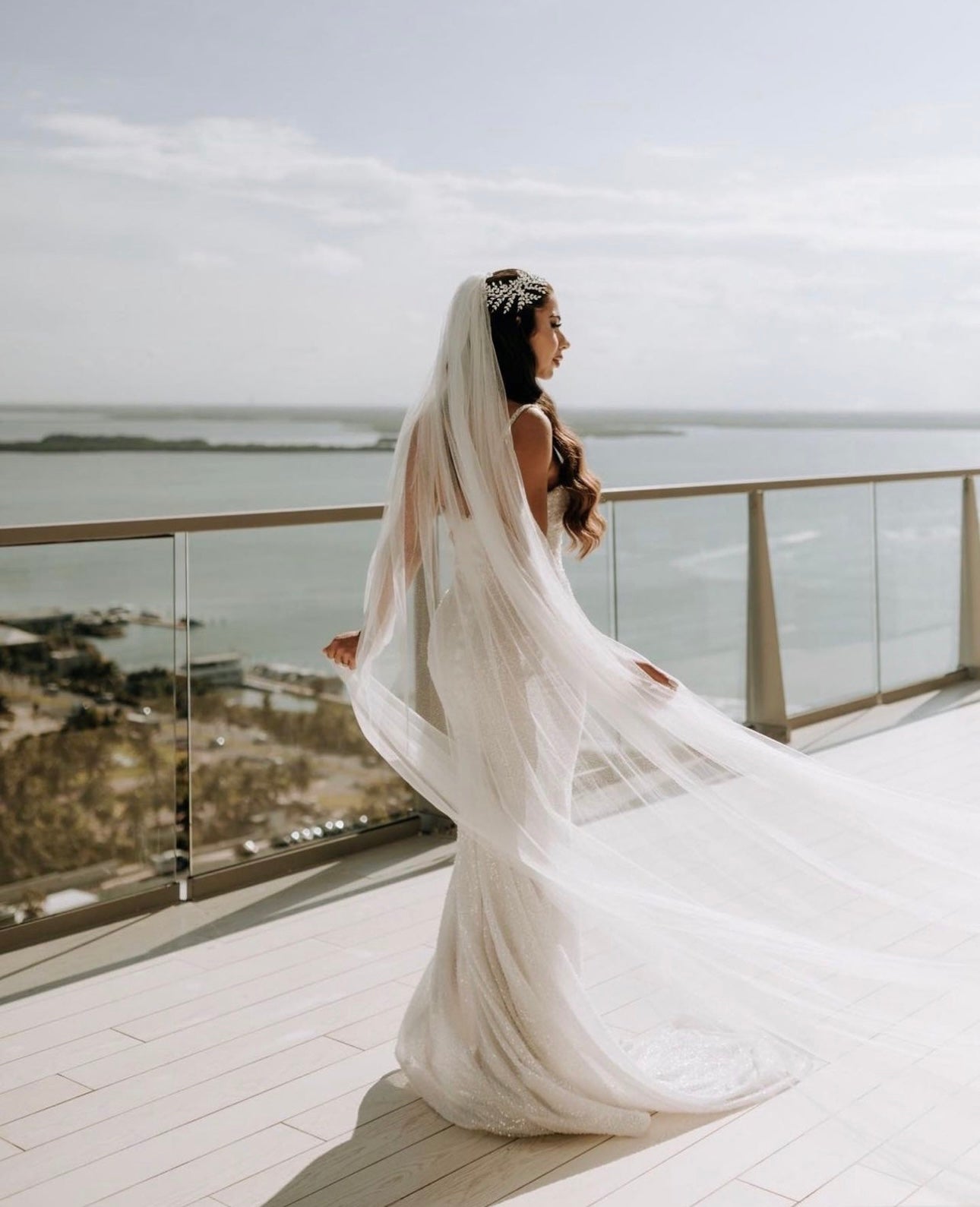 Bride Diana wears a custom Lauren Elaine beaded trumpet wedding dress for her wedding in Mexico.