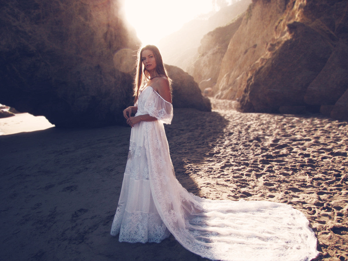 Off-the-shoulder bohemian lace wedding gown with cathedral lace train by Lauren Elaine Bridal