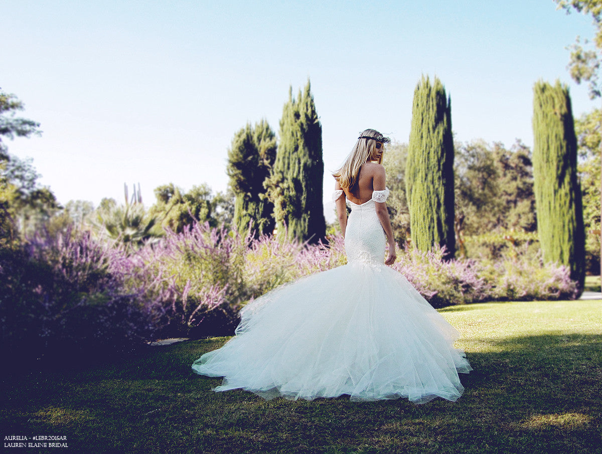 Off the shoulder vintage lace and tulle bridal gown with lace sleeves.