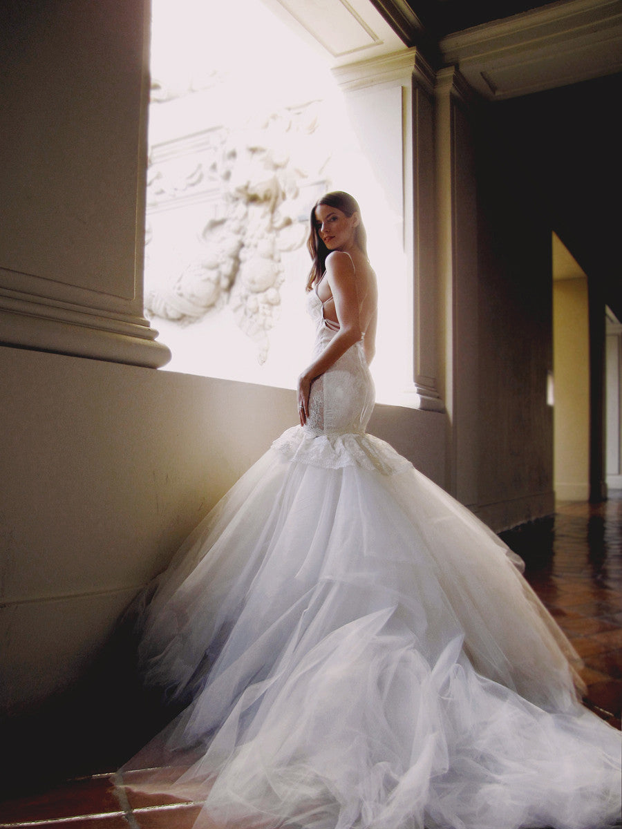 Backless mermaid wedding gown with detachable train and lace-up back