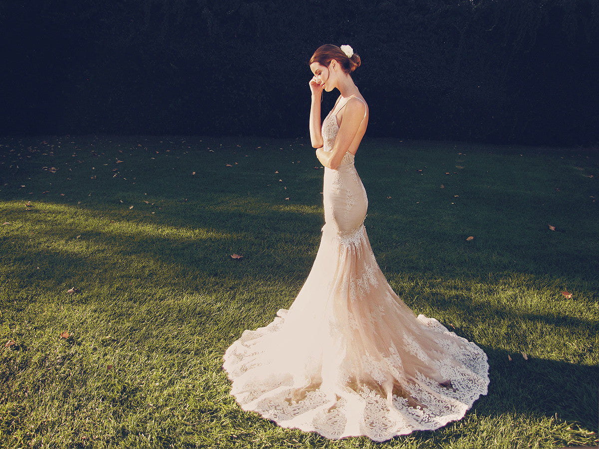 Blushing nude illusion mermaid wedding gown with lace train and sweetheart bodice with spaghetti straps