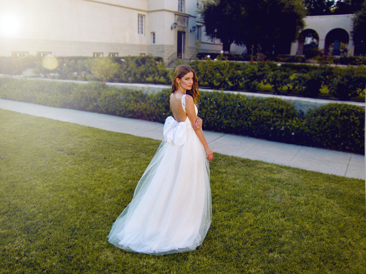 Open back tulle wedding gown with bow. Made in the USA.