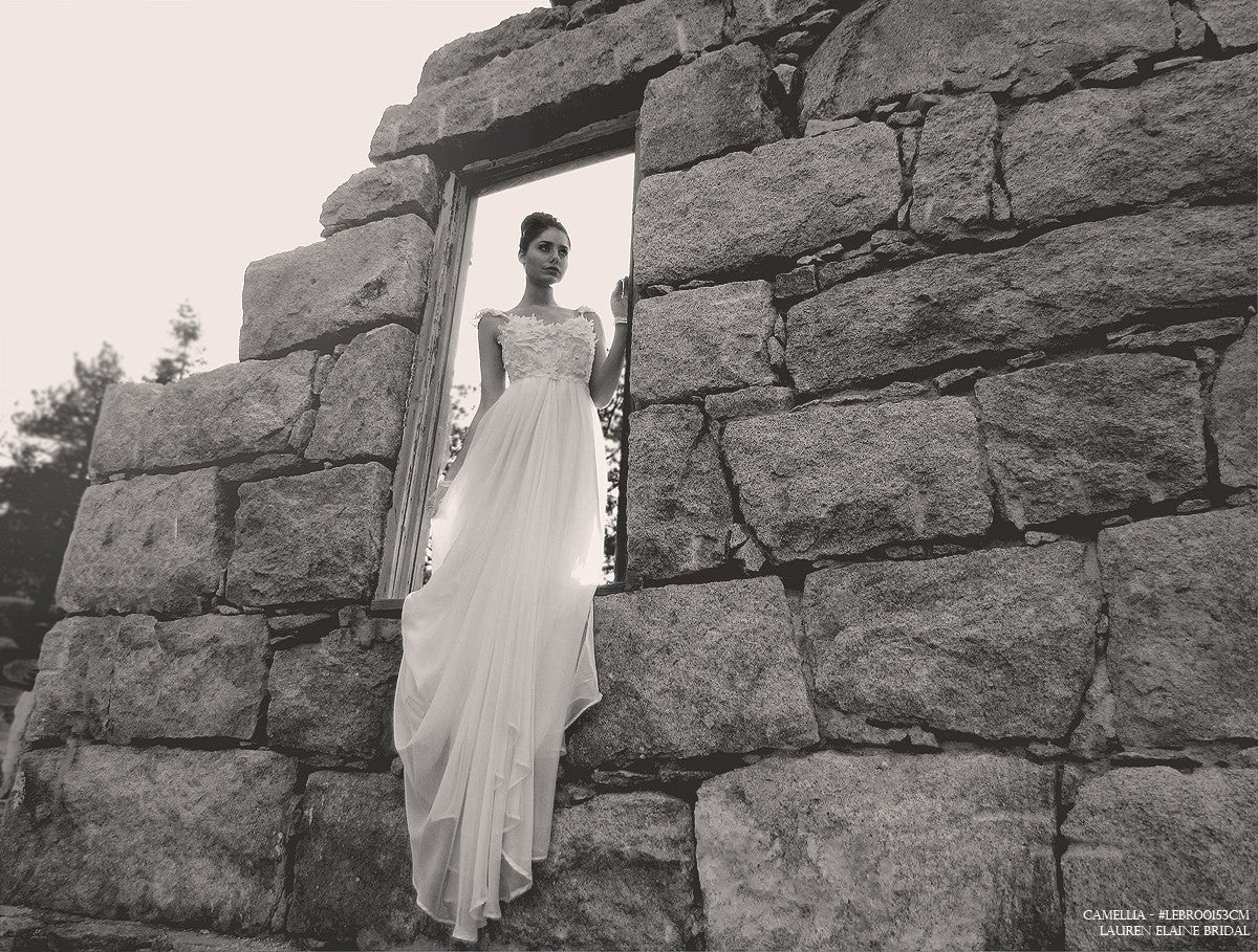 Bohemian wedding dress by Lauren Elaine Bridal. Vintage lace and chiffon sweetheart wedding dress with capped sleeves.