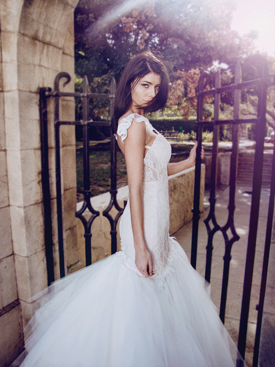 Backless illusion mermaid wedding gown with sheer nude blush underlay and corset bodice