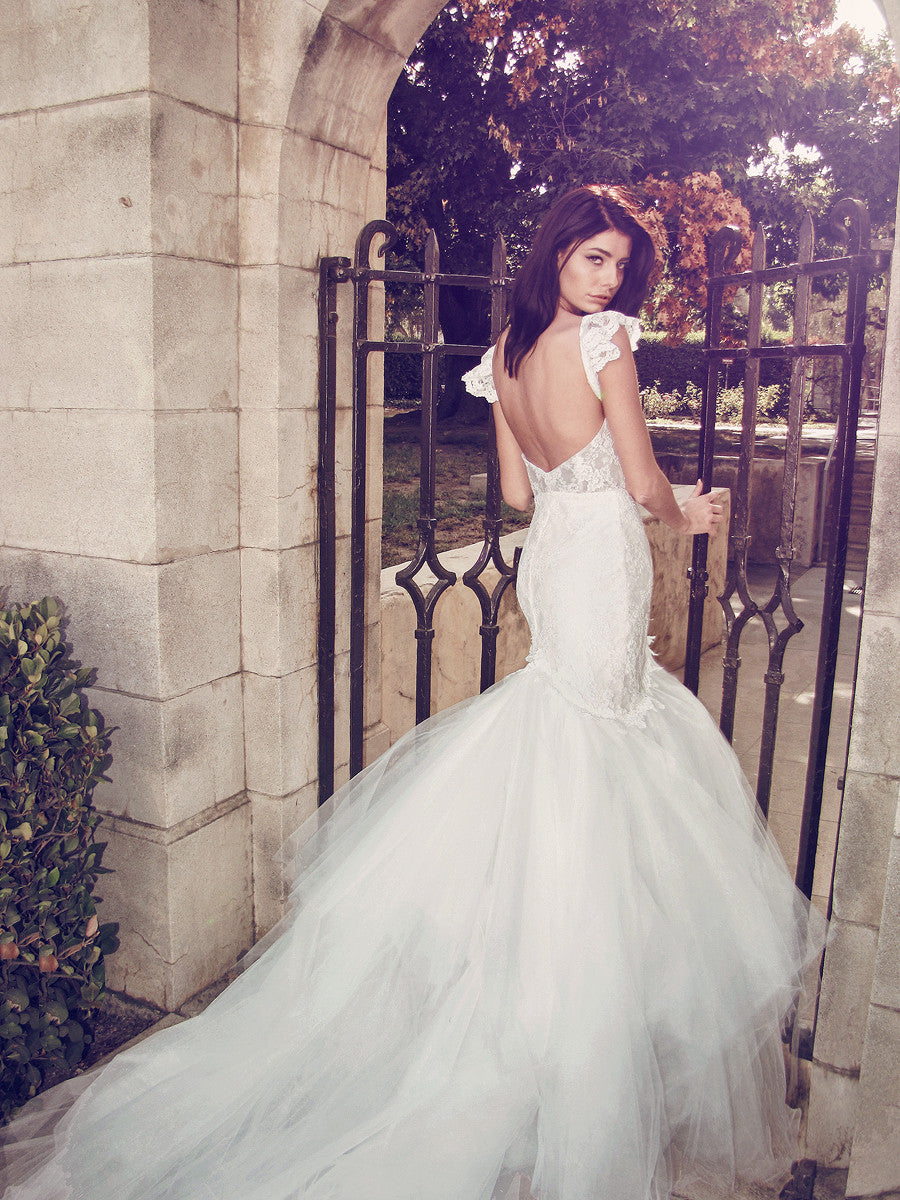Backless mermaid wedding dress with cathedral train and ruffle sleeves
