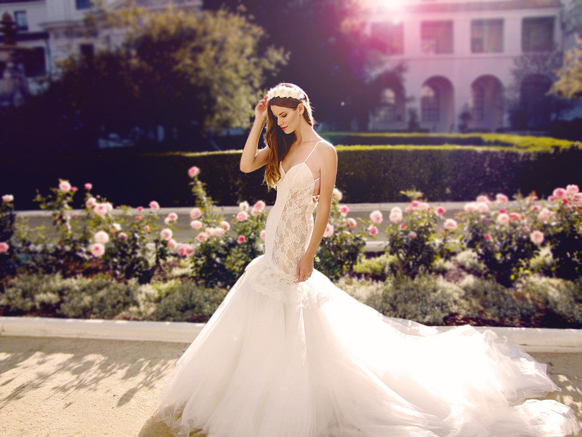 Catania mermaid wedding gown with cathedral train and champagne illusion detailing for peek-a-boo effect