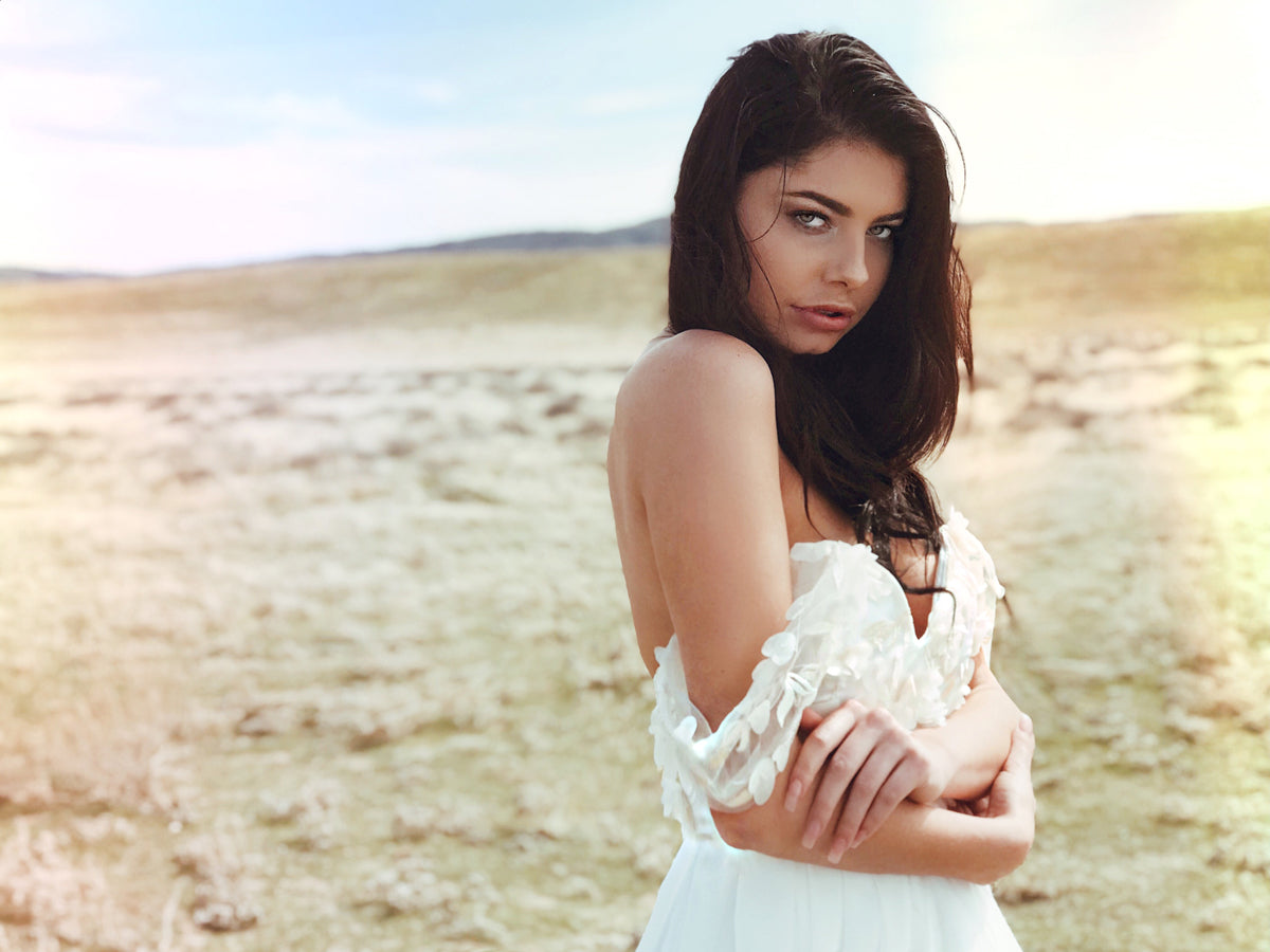 Romantic off-the-shoulder wedding dress with sweetheart bodice and textured 3D floral detailing. Chyrsalin from the Pearl by Lauren Elaine Bridal collection.