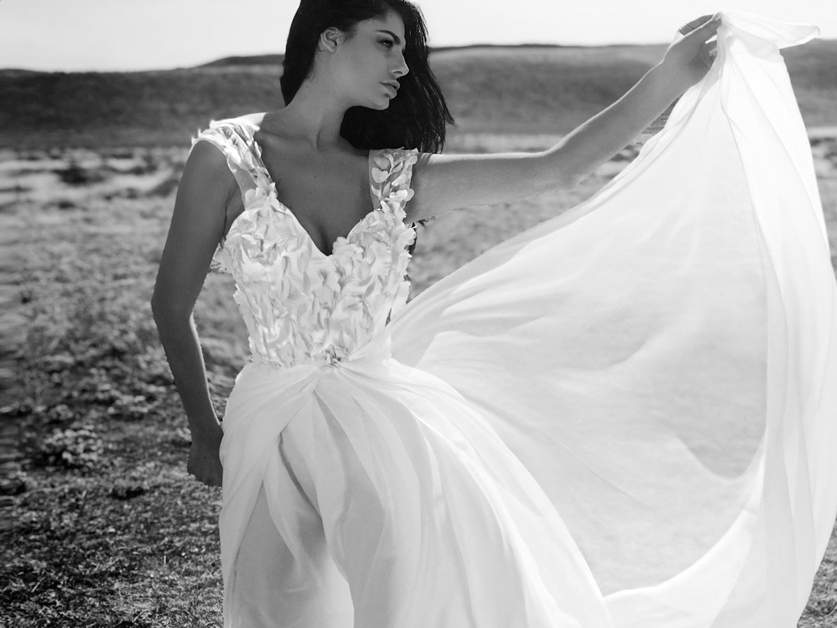 Capped sleeve wedding dress with 3D floral lace detailing and chiffon skirt with cathedral train