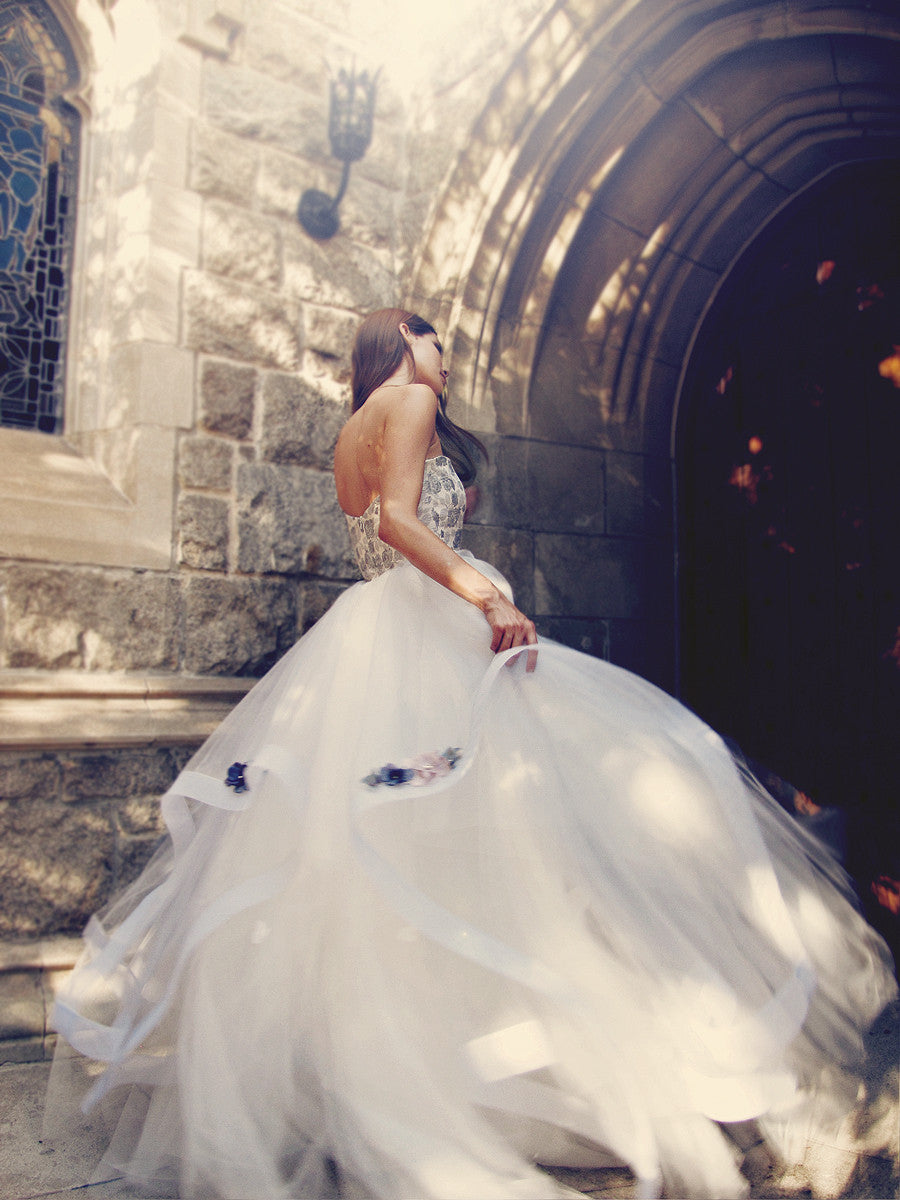 Fairytale blue wedding gown with colored flowers and layered horsehair skirt of tulle.