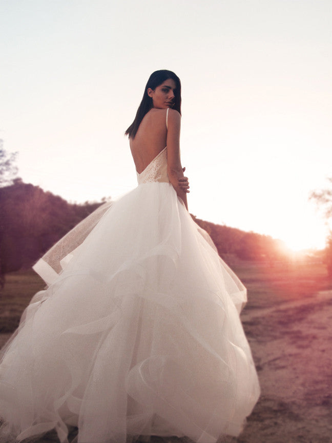 Backless ballerina tulle and lace ball gown wedding dress in blush in the sunset