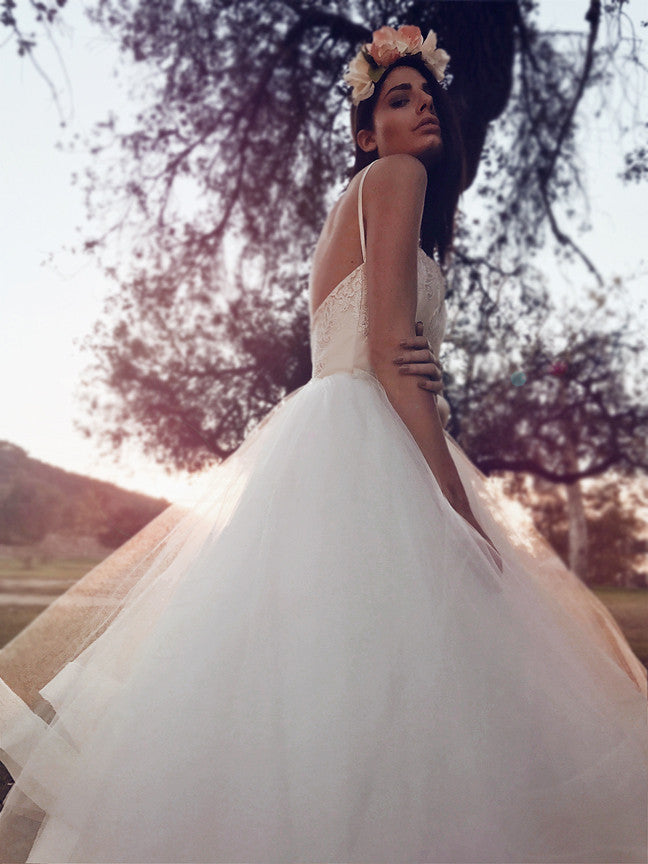 Bohemian tulle and lace ball gown wedding dress with sweetheart bodice and spaghetti straps in ivory and blush