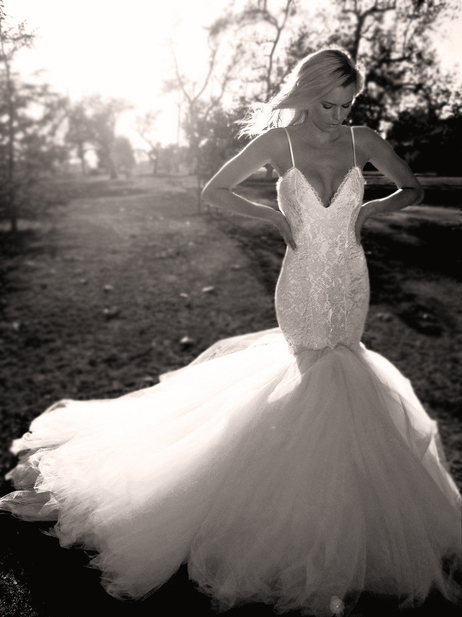 Sexy mermaid wedding dress with sweetheart bodice, eyelash lace, and tulle train.