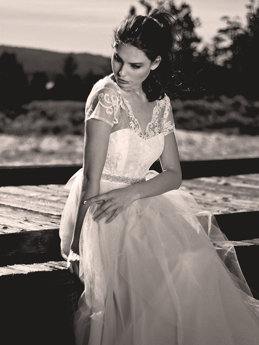 Scalloped scroll lace illusion gown with eyelash trim. Backless bridal gown.