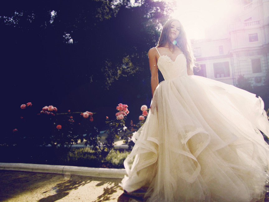 Layered tulle ball gown wedding gown with sweetheart bodice and spaghetti straps.