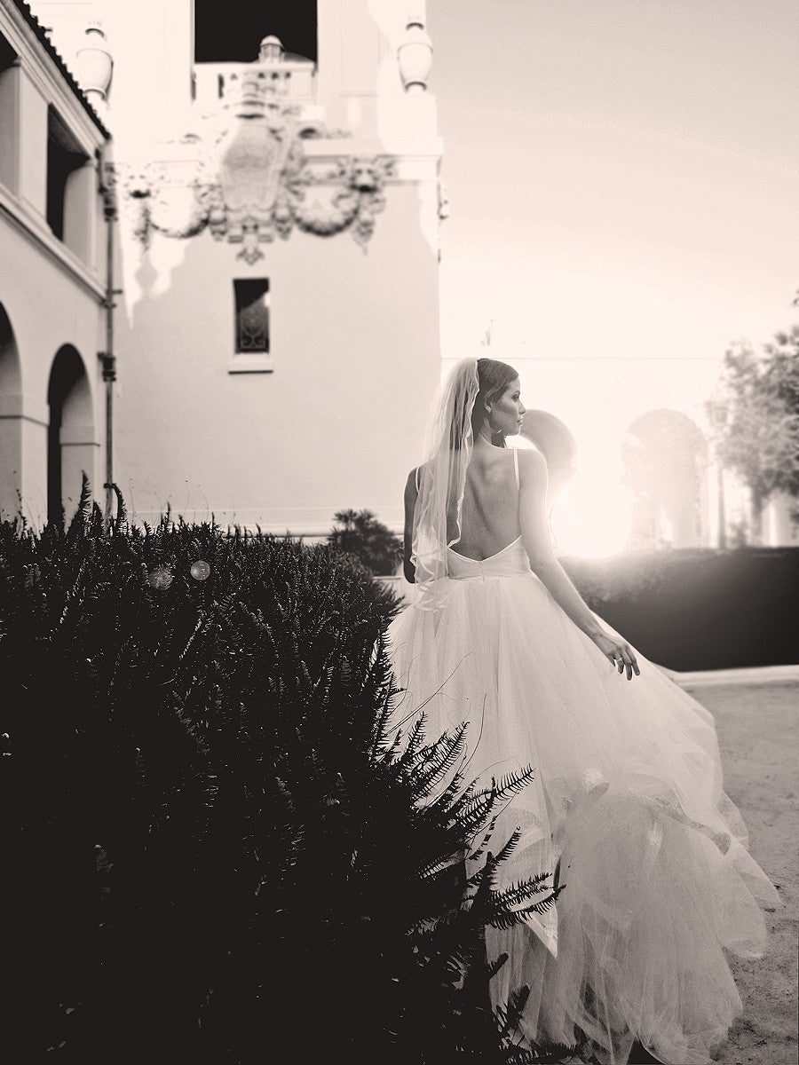 Backless tulle wedding gown with layered tulle skirts by Lauren Elaine Bridal.
